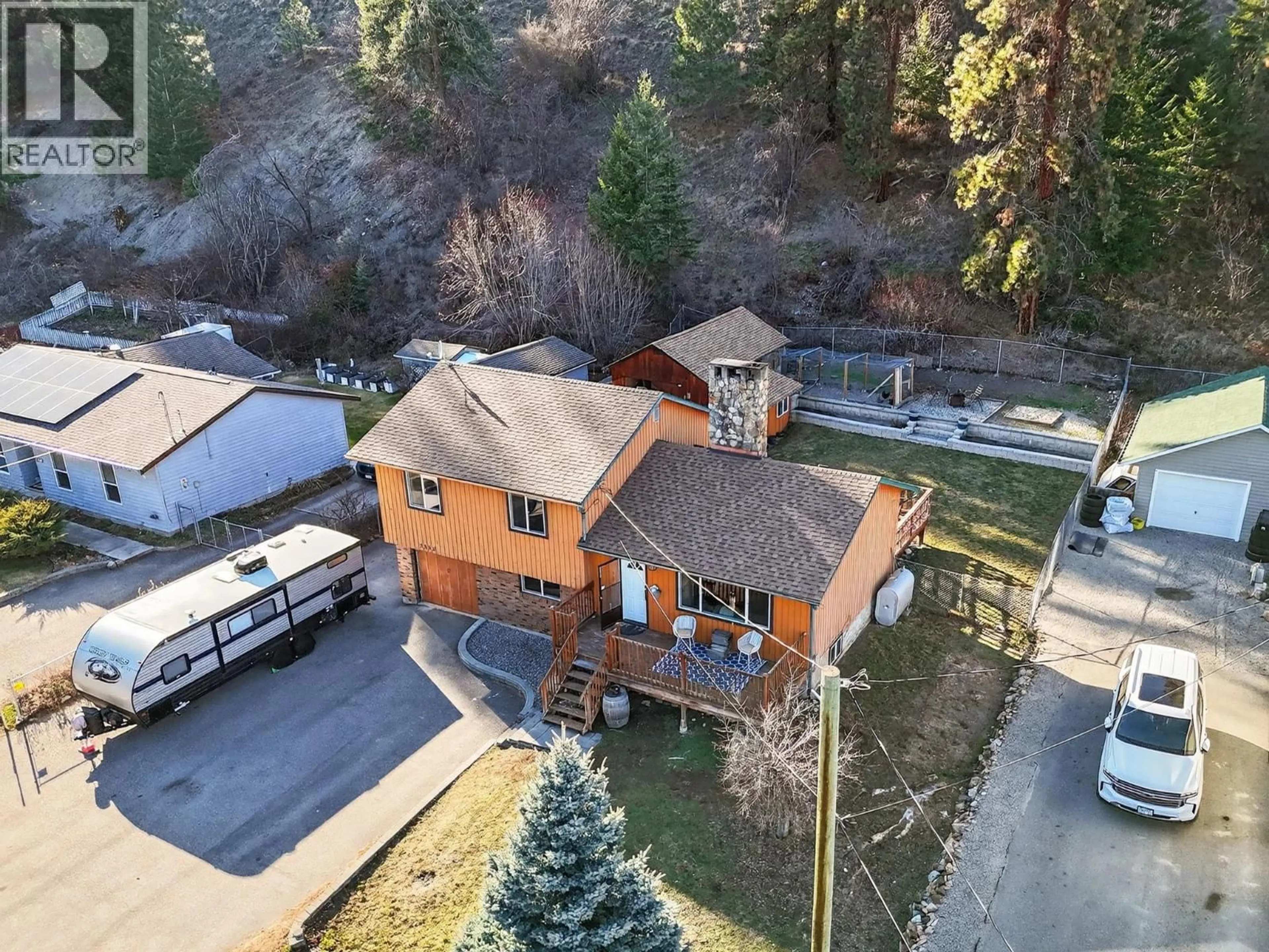 A pic from outside/outdoor area/front of a property/back of a property/a pic from drone, street for 7312 FINTRY DELTA ROAD, Kelowna British Columbia V1Z3V2