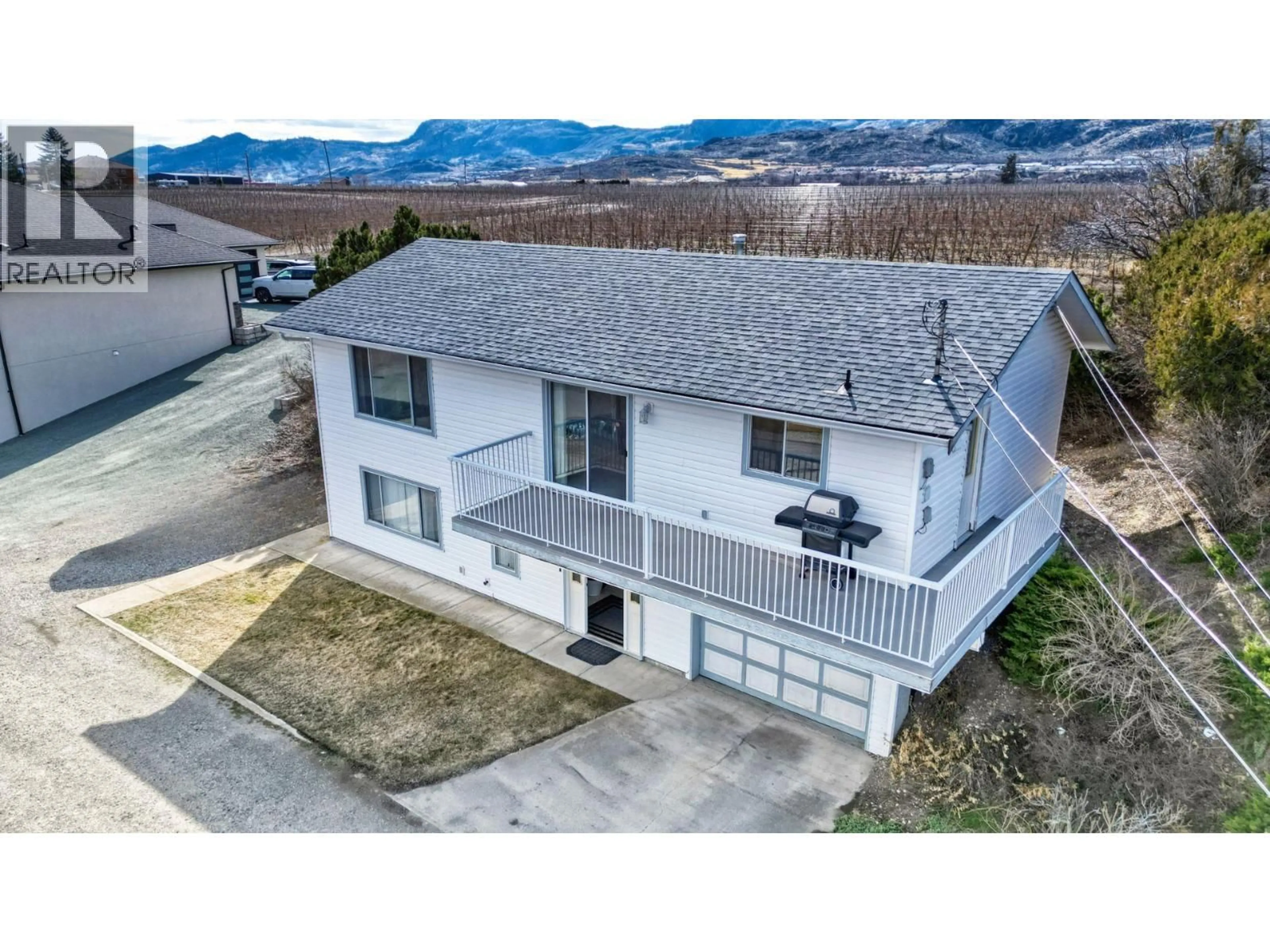 A pic from outside/outdoor area/front of a property/back of a property/a pic from drone, mountain view for 10408 87TH STREET, Osoyoos British Columbia V0H1V2