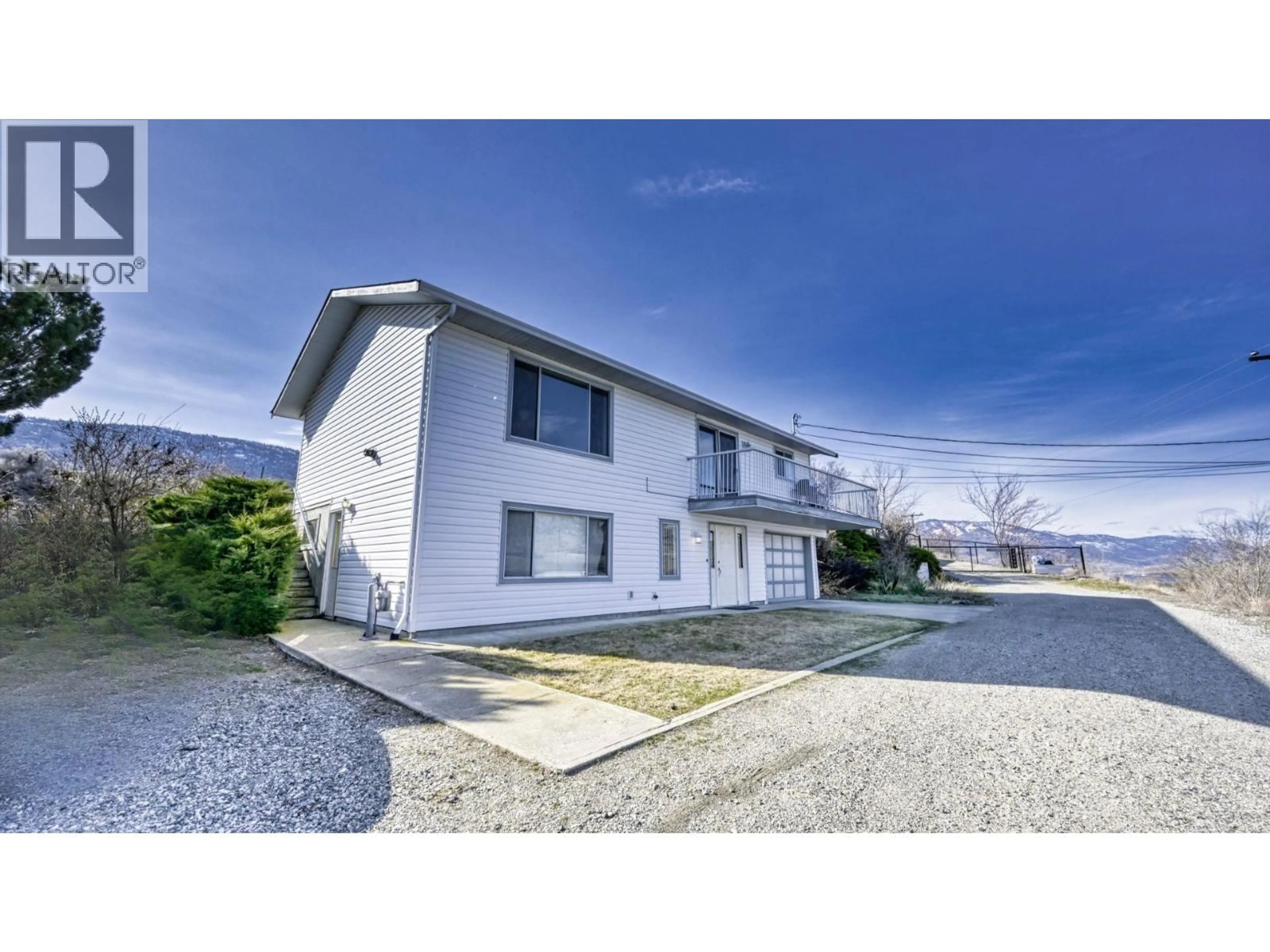 A pic from outside/outdoor area/front of a property/back of a property/a pic from drone, street for 10408 87TH STREET, Osoyoos British Columbia V0H1V2