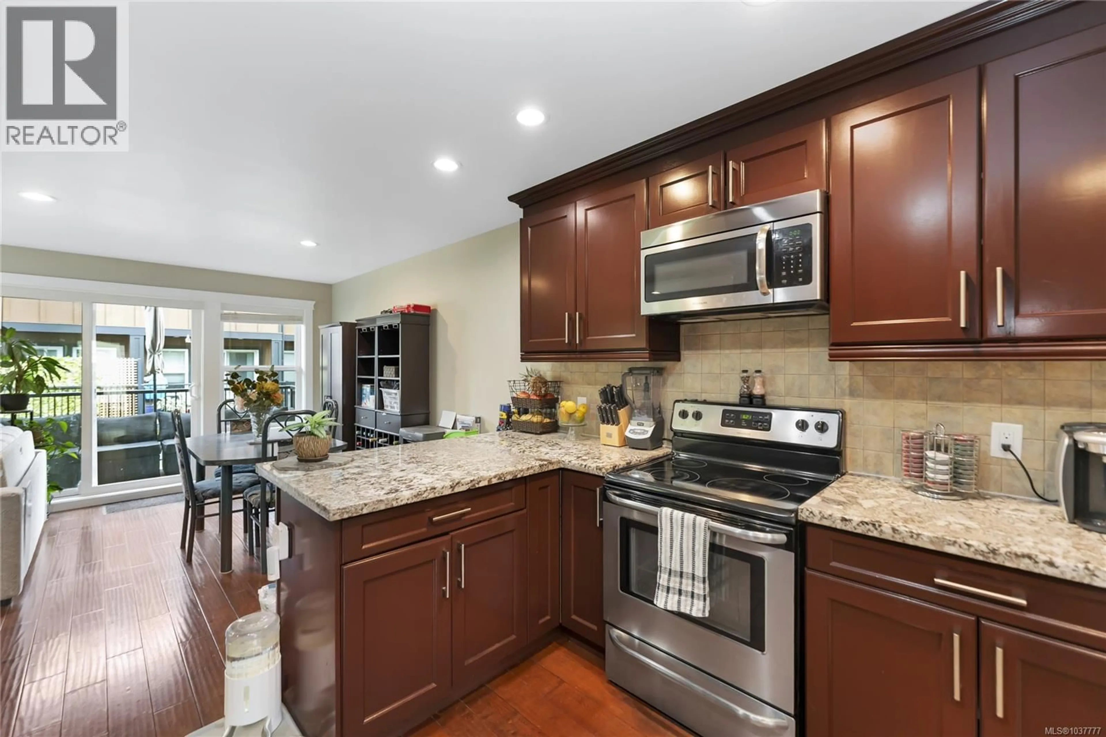 Open concept kitchen, ceramic/tile floor for 101 - 982 RATTANWOOD PLACE, Langford British Columbia V9C0C7