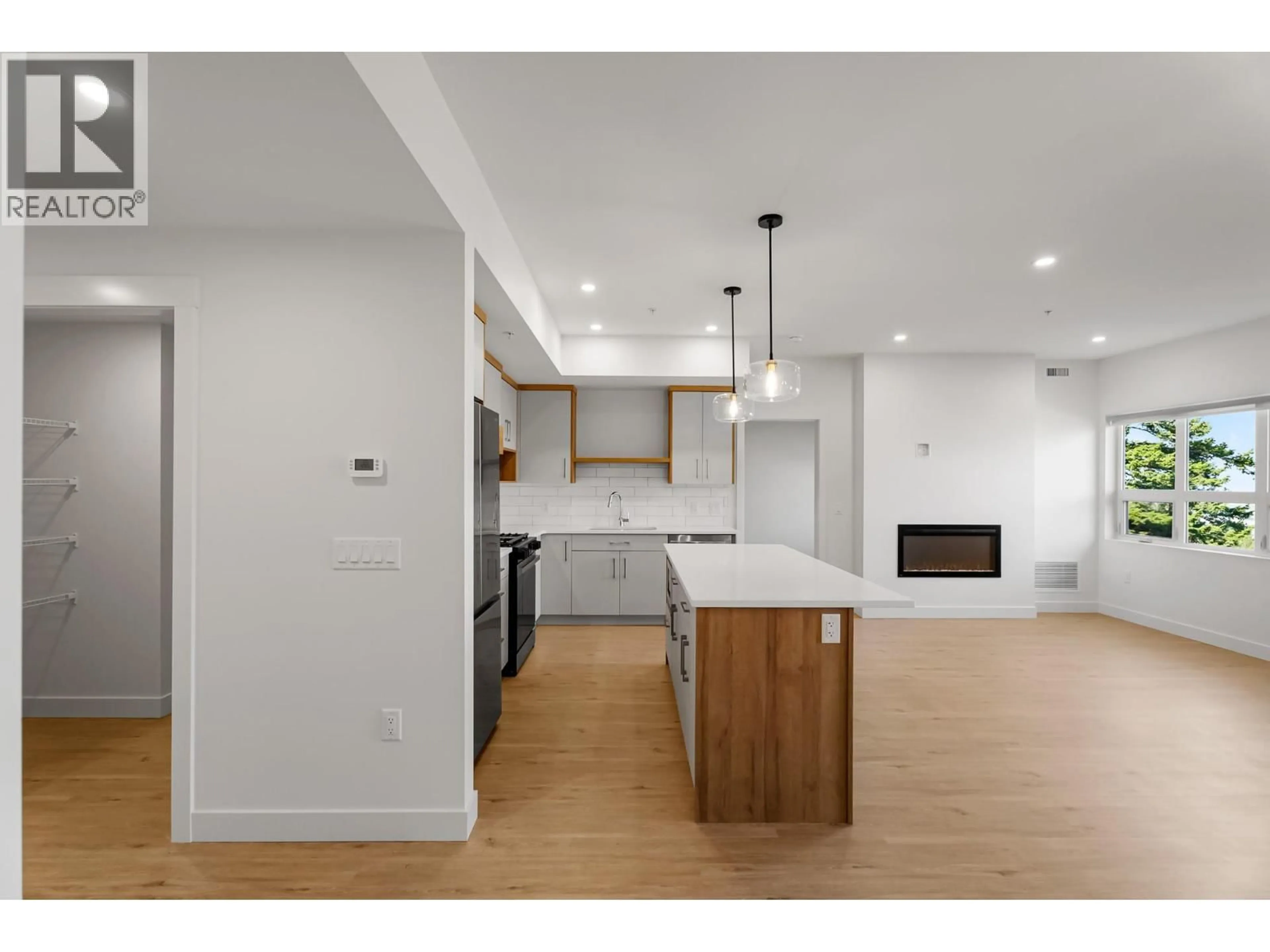 Open concept kitchen, wood/laminate floor for 206 - 1844 QU'APPELLE BOULEVARD, Kamloops British Columbia V2E0E8