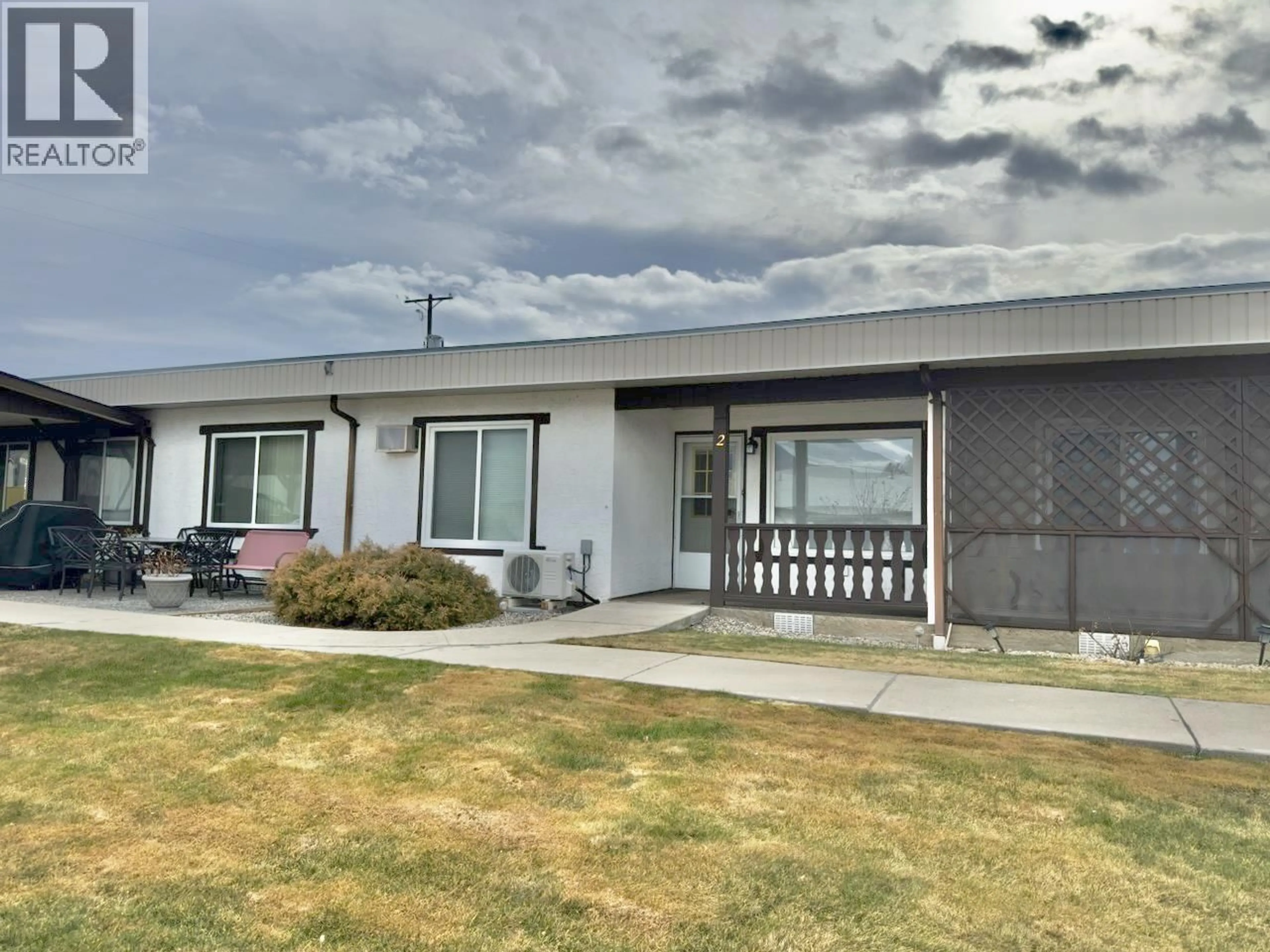 A pic from outside/outdoor area/front of a property/back of a property/a pic from drone, street for 2 - 5852 AIRPORT STREET, Oliver British Columbia V0H1T0
