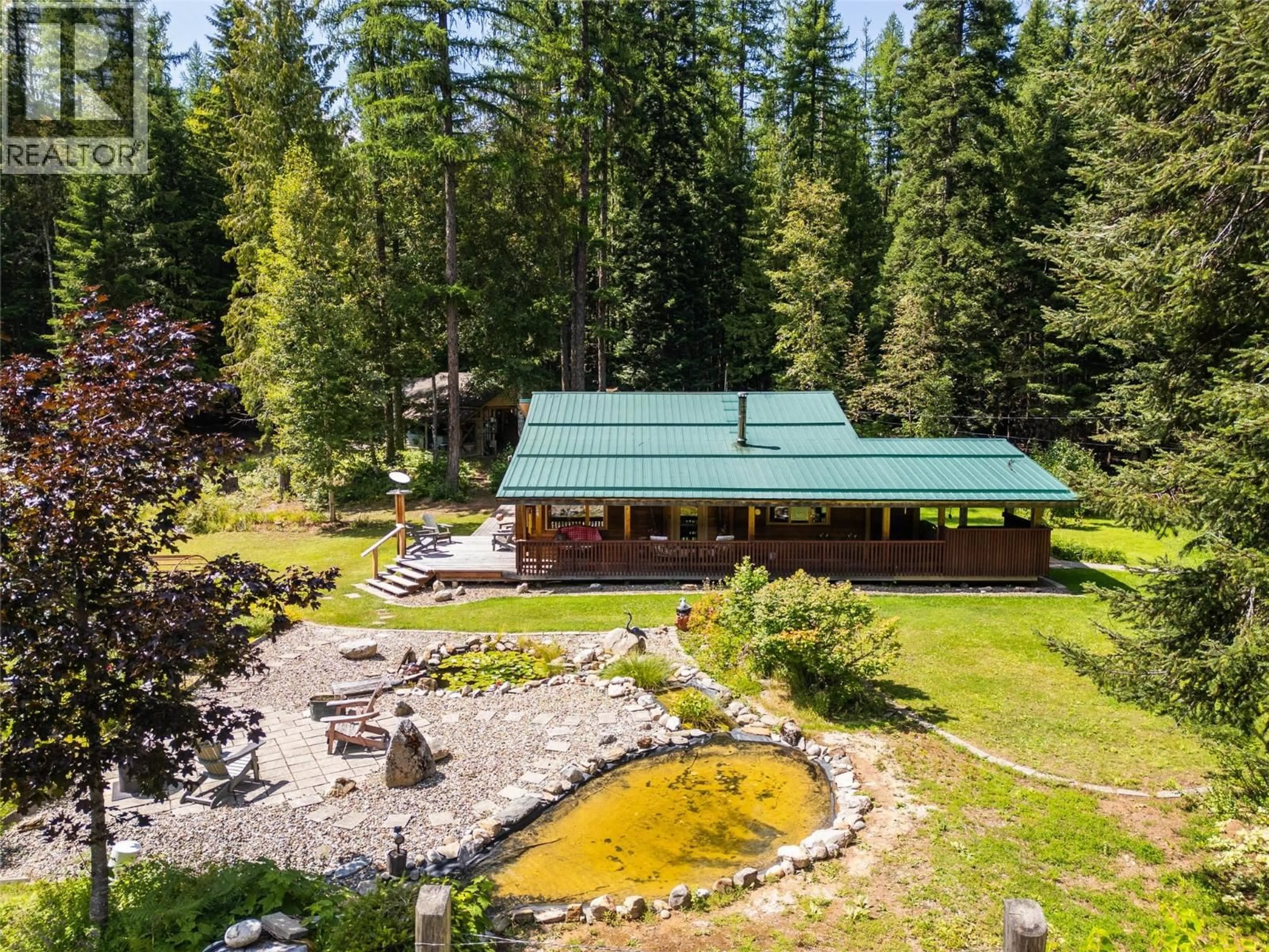 A pic from outside/outdoor area/front of a property/back of a property/a pic from drone, forest/trees view for 541 BEAR ROAD, Salmo British Columbia V0G1Z0