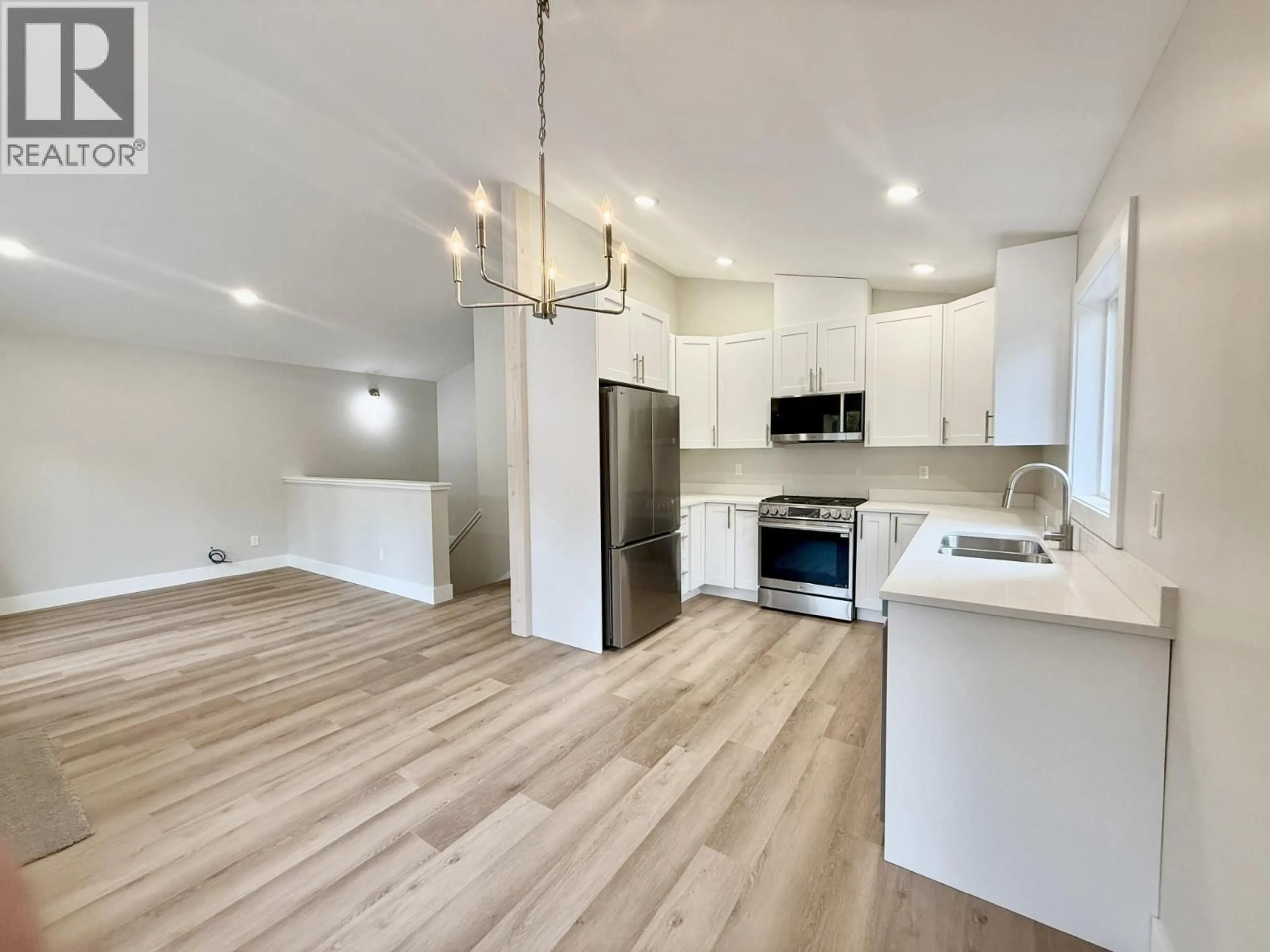 Open concept kitchen, wood/laminate floor for 7 - 1938 FOXWOOD TRAIL, Windermere British Columbia V0B2L2