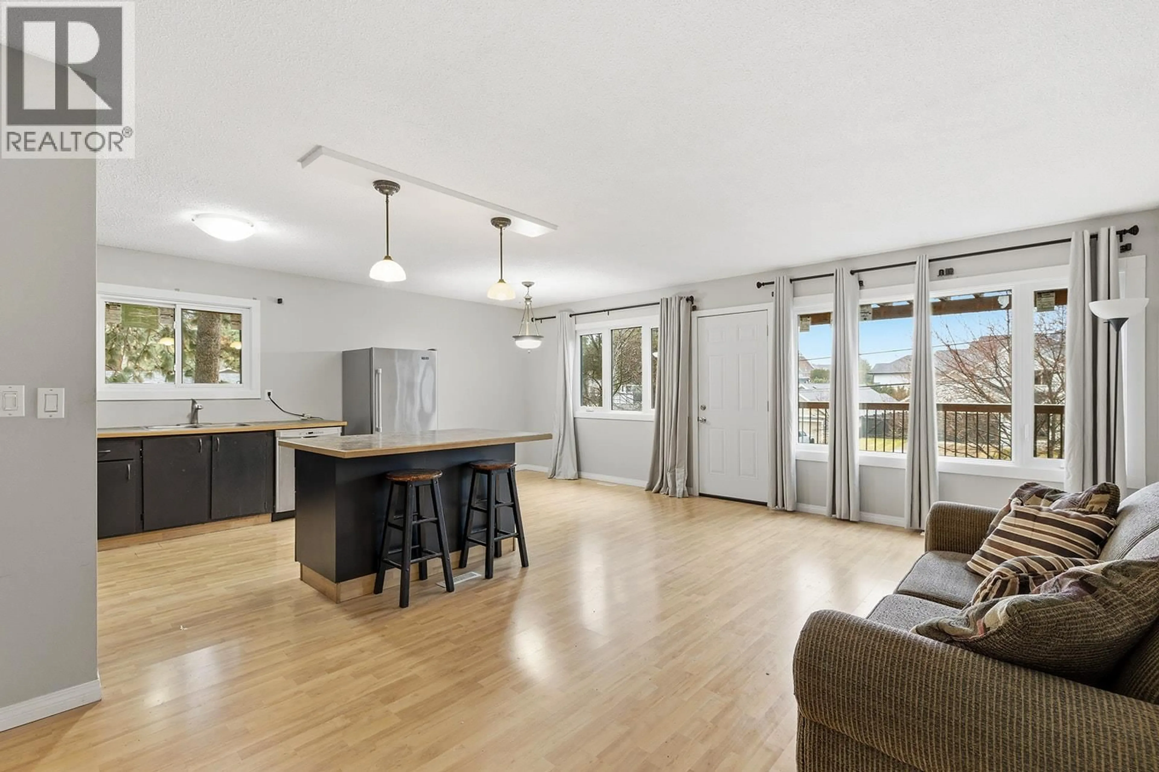Open concept kitchen, wood/laminate floor for 5187 CHUTE LAKE CRESCENT, Kelowna British Columbia V1W4L7
