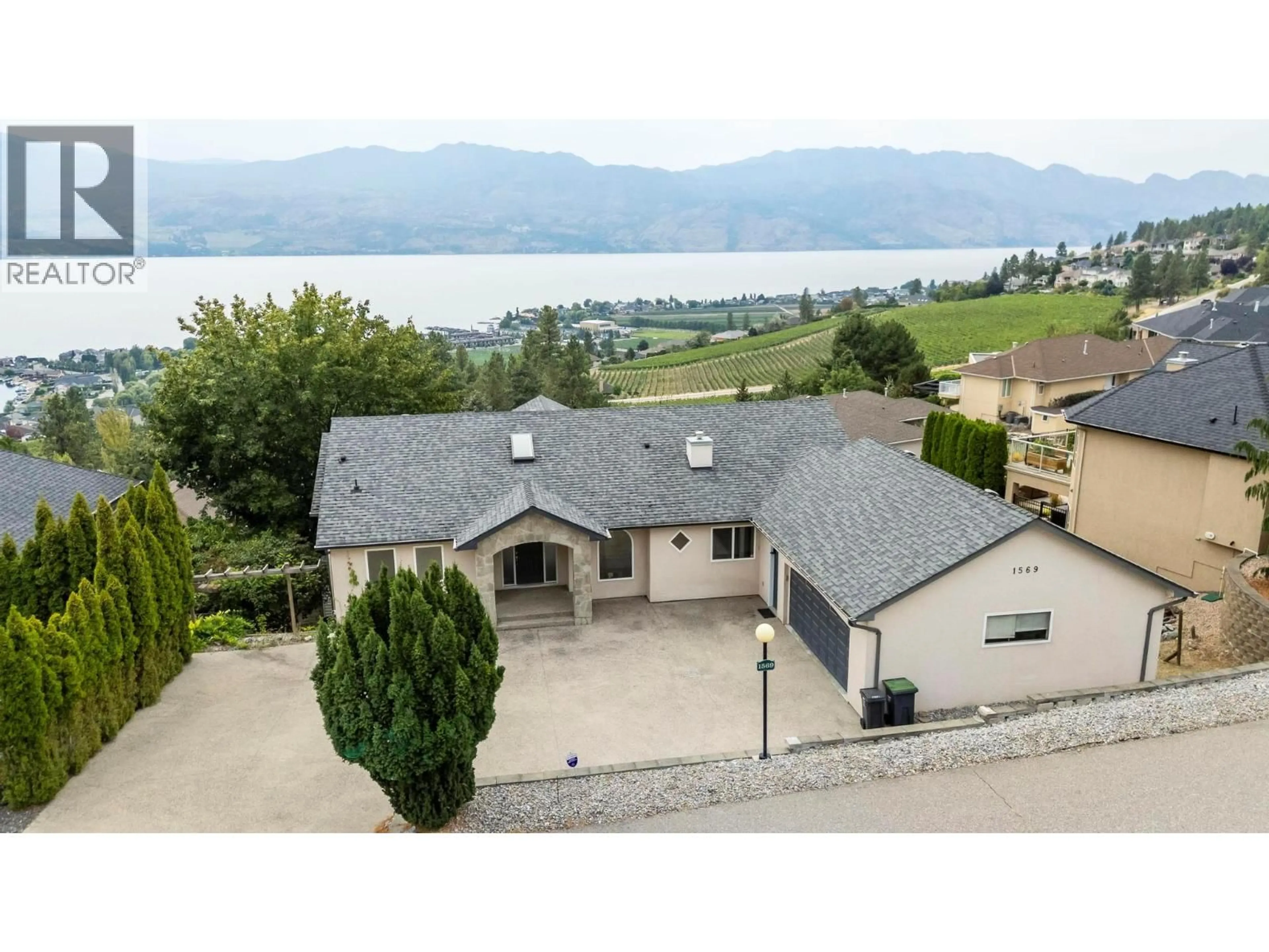 A pic from outside/outdoor area/front of a property/back of a property/a pic from drone, water/lake/river/ocean view for 1569 GREGORY ROAD, West Kelowna British Columbia V4T2V7