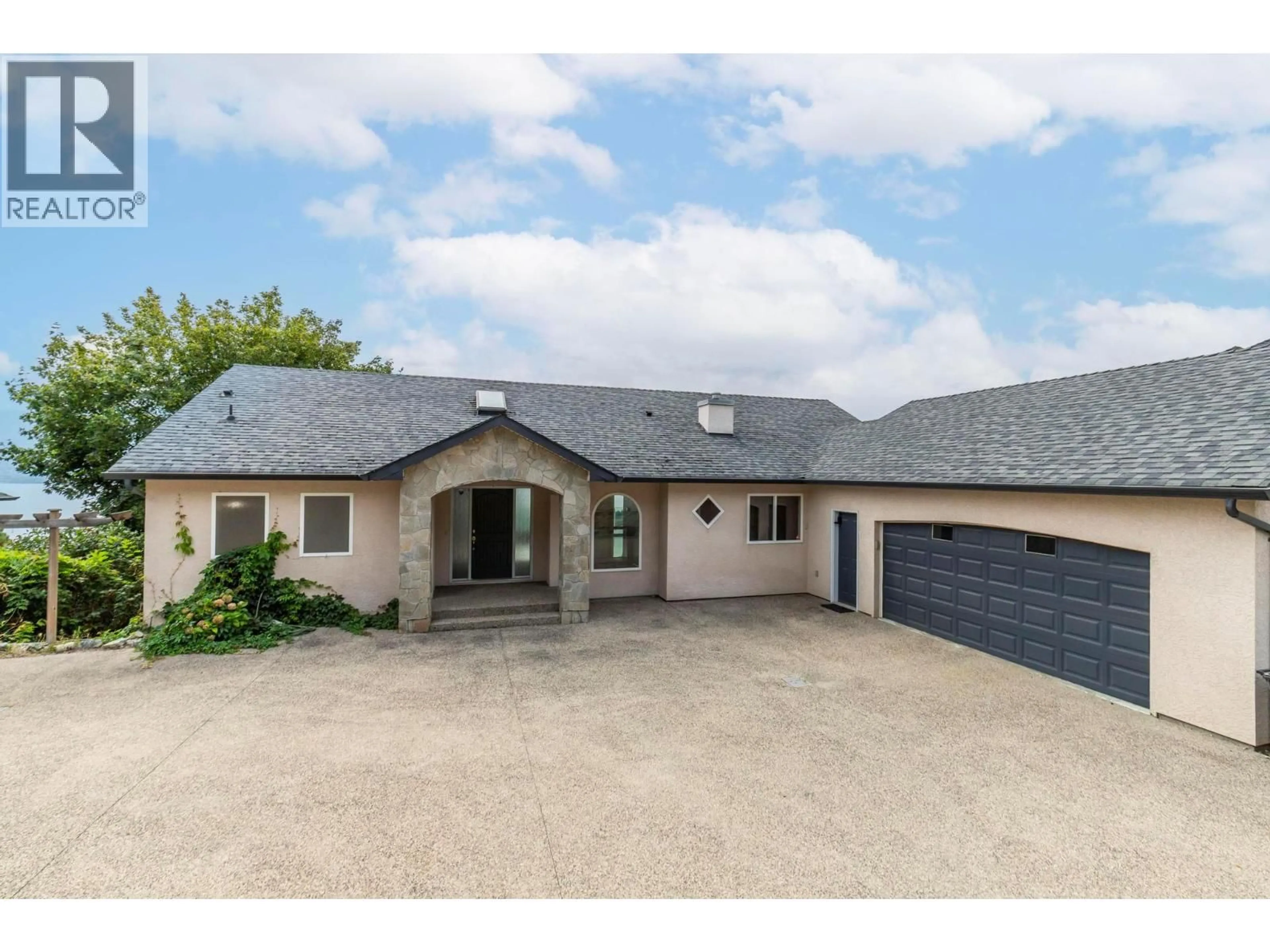 A pic from outside/outdoor area/front of a property/back of a property/a pic from drone, street for 1569 GREGORY ROAD, West Kelowna British Columbia V4T2V7