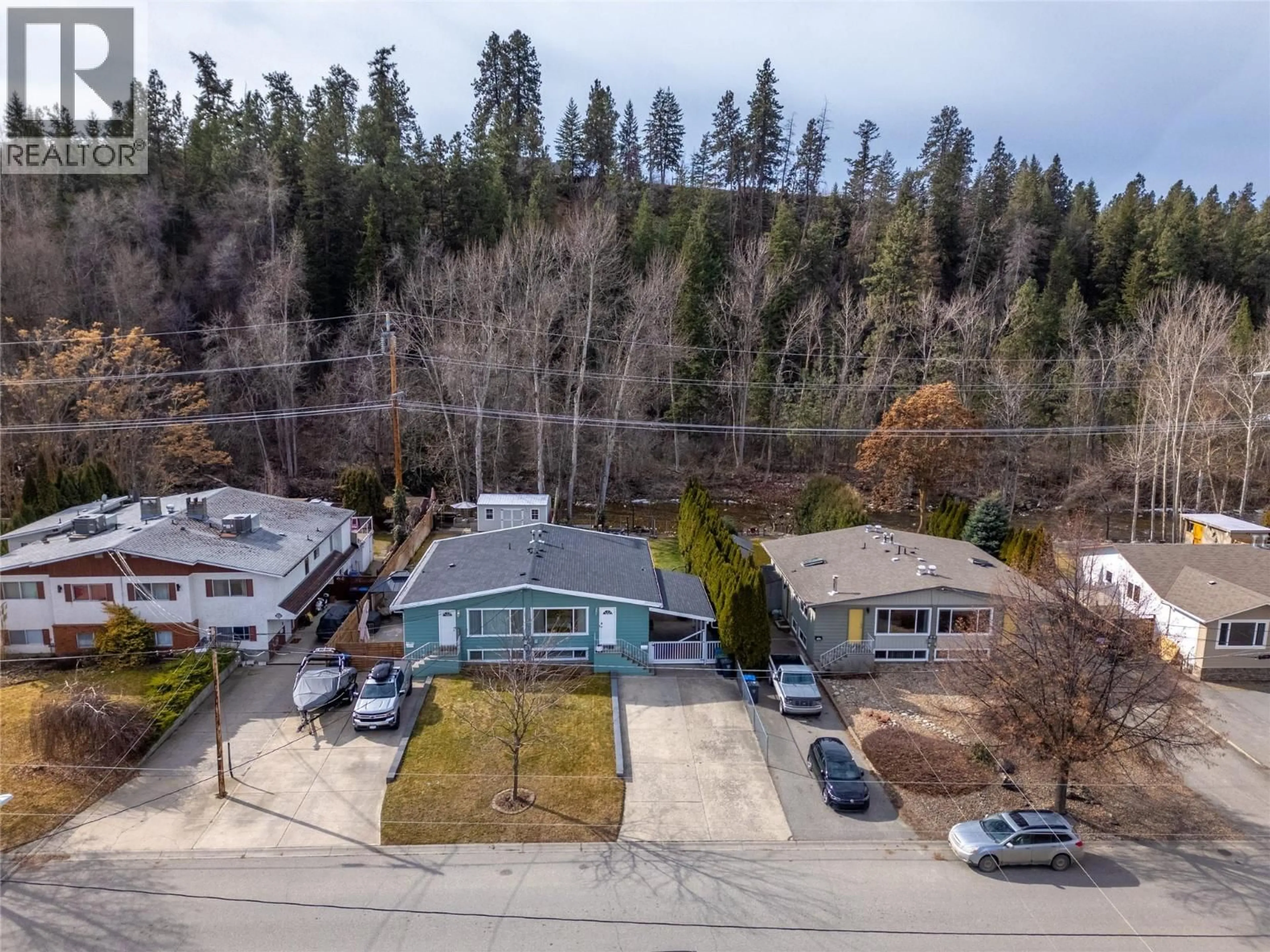 A pic from outside/outdoor area/front of a property/back of a property/a pic from drone, mountain view for 1357 CREEKSIDE ROAD, Kelowna British Columbia V1X1B2