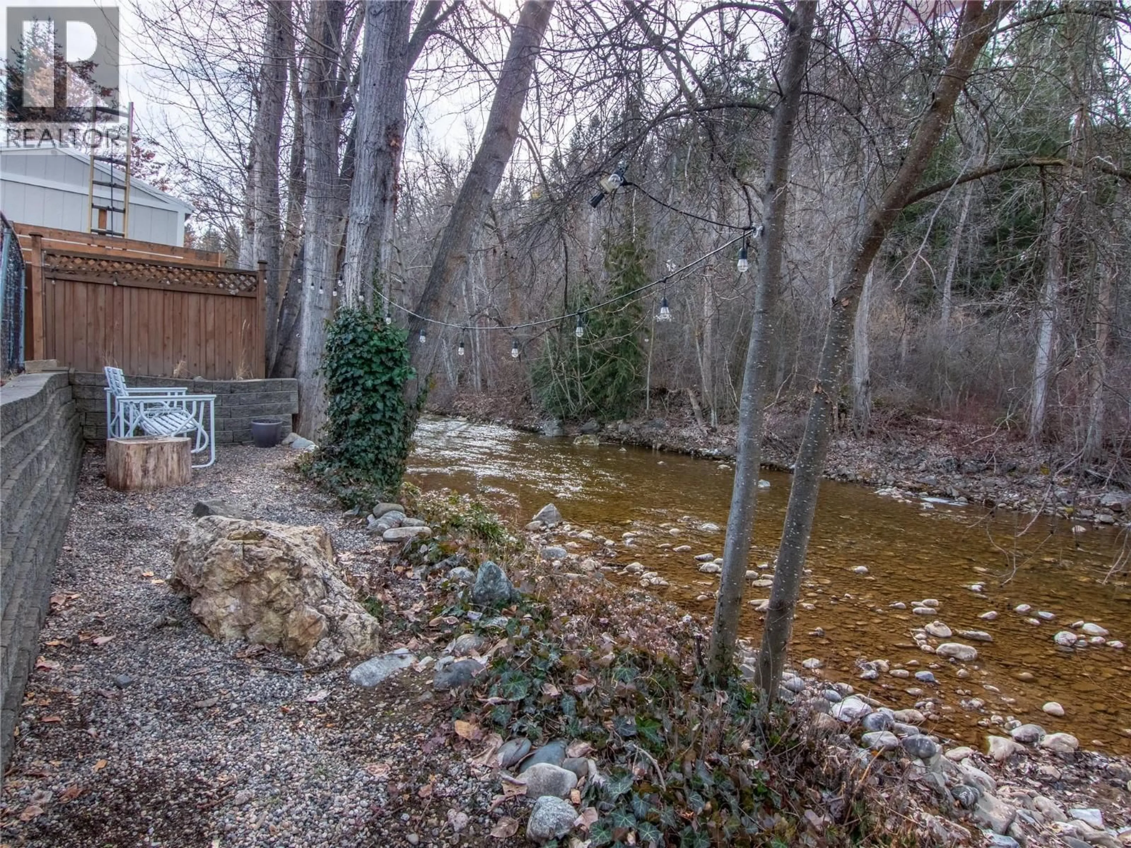 A pic from outside/outdoor area/front of a property/back of a property/a pic from drone, forest/trees view for 1357 CREEKSIDE ROAD, Kelowna British Columbia V1X1B2