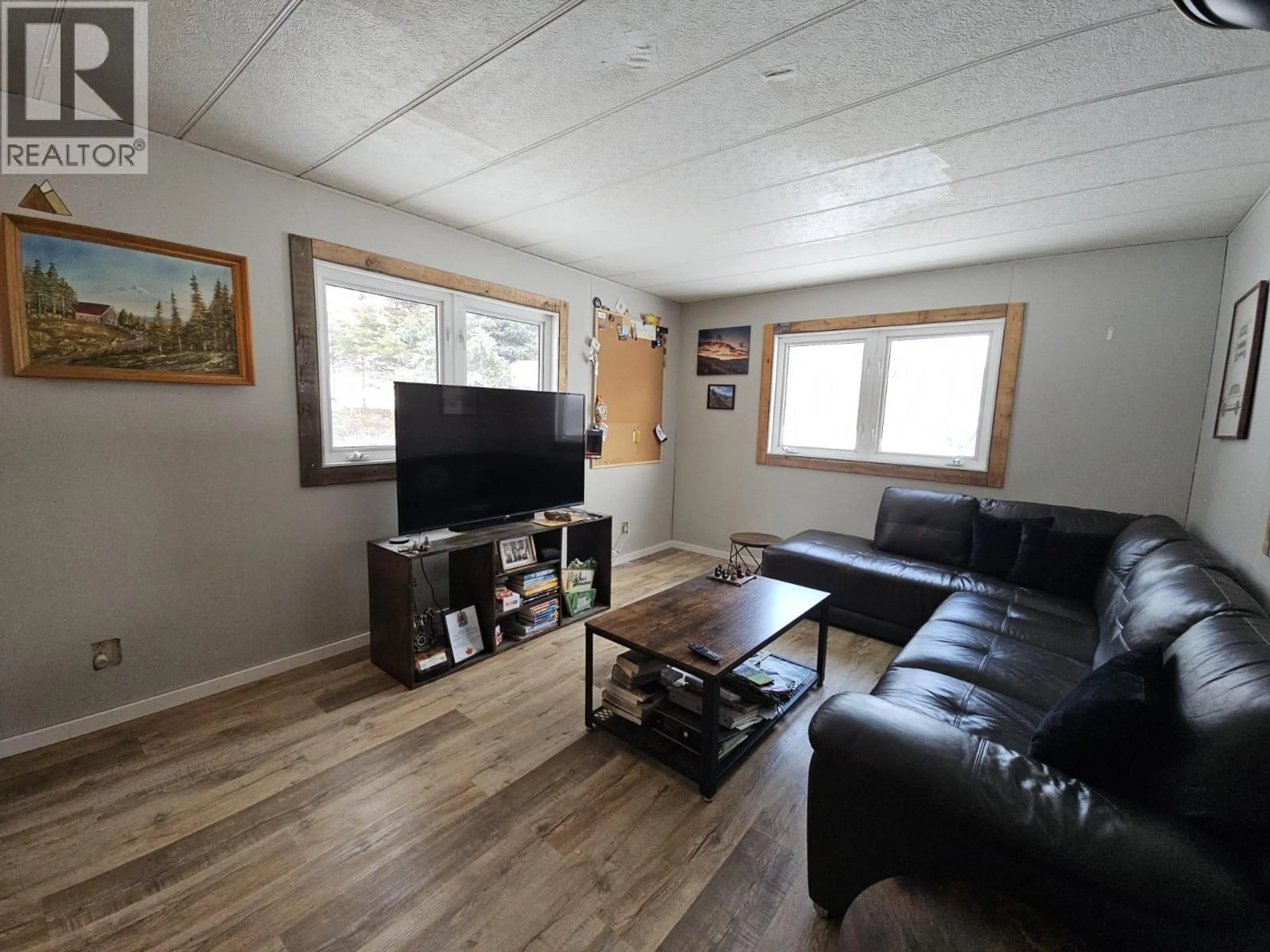 Living room with furniture, wood/laminate floor for 6379 WILDMARE OTHER, Chetwynd British Columbia V0C1J0