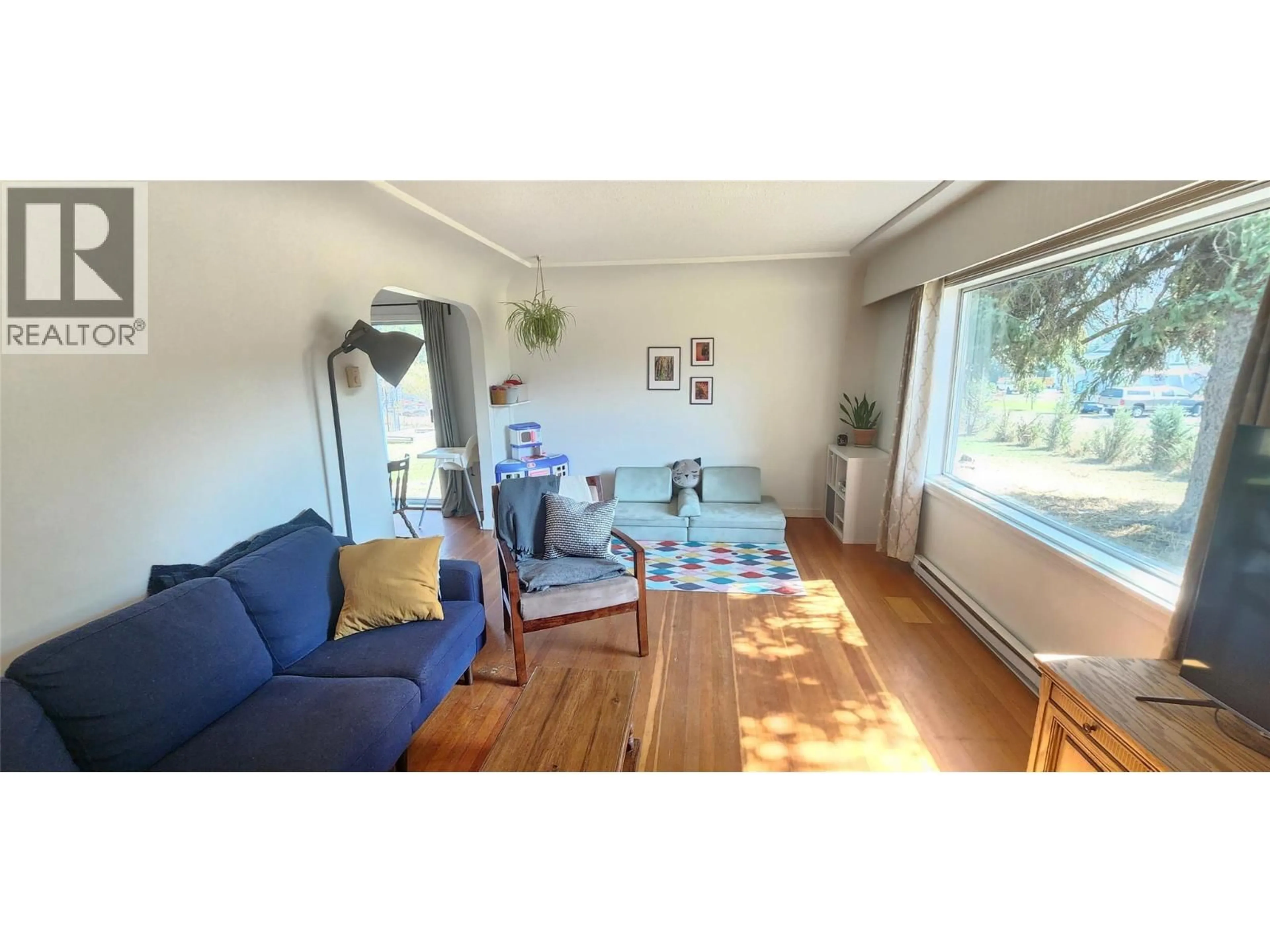 Living room with furniture, wood/laminate floor for 4960 VERNON STREET, Grand Forks British Columbia V0H1H5