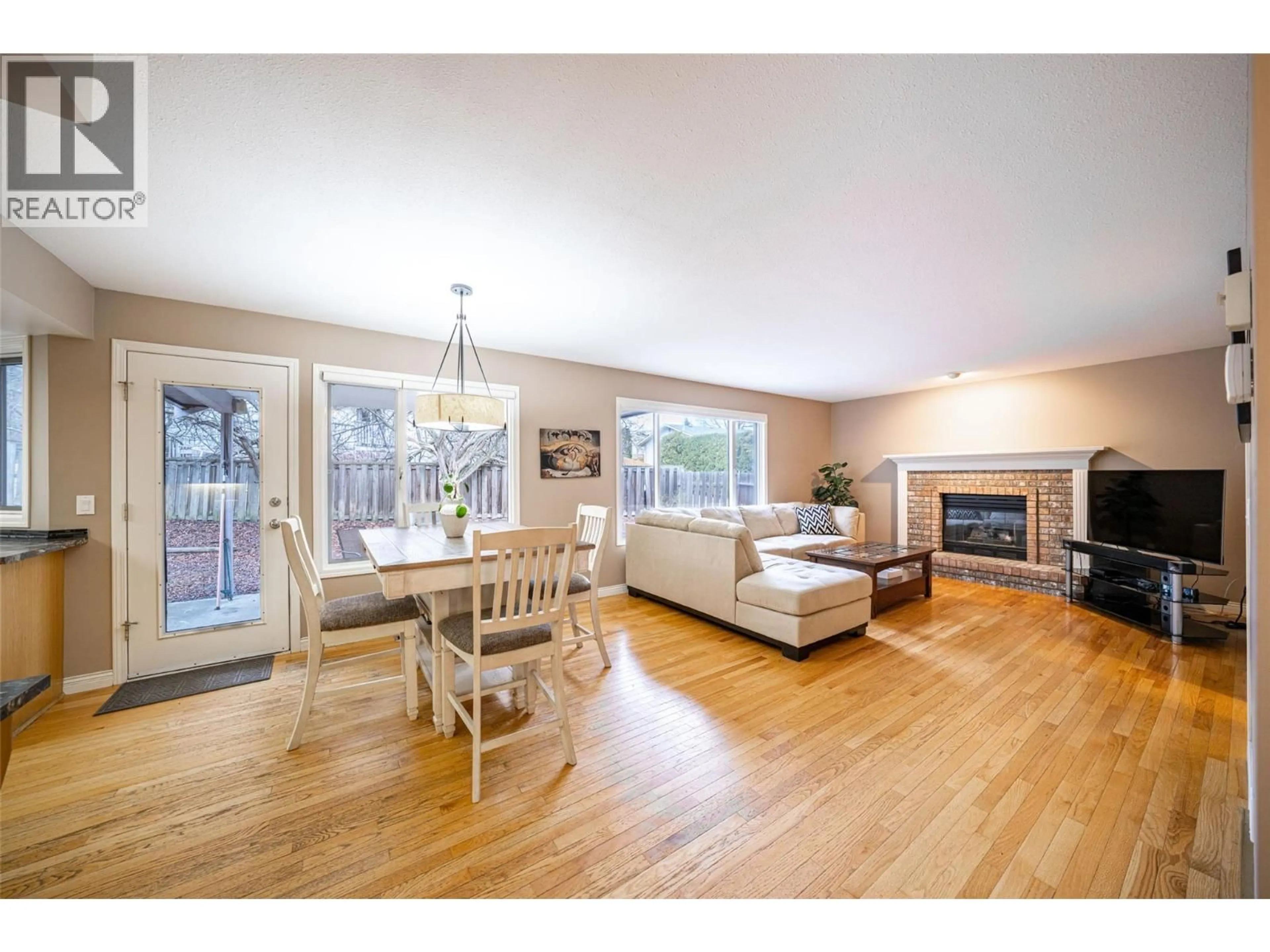 Living room with furniture, wood/laminate floor for 2921 FIELDSTONE COURT, West Kelowna British Columbia V4T1S9
