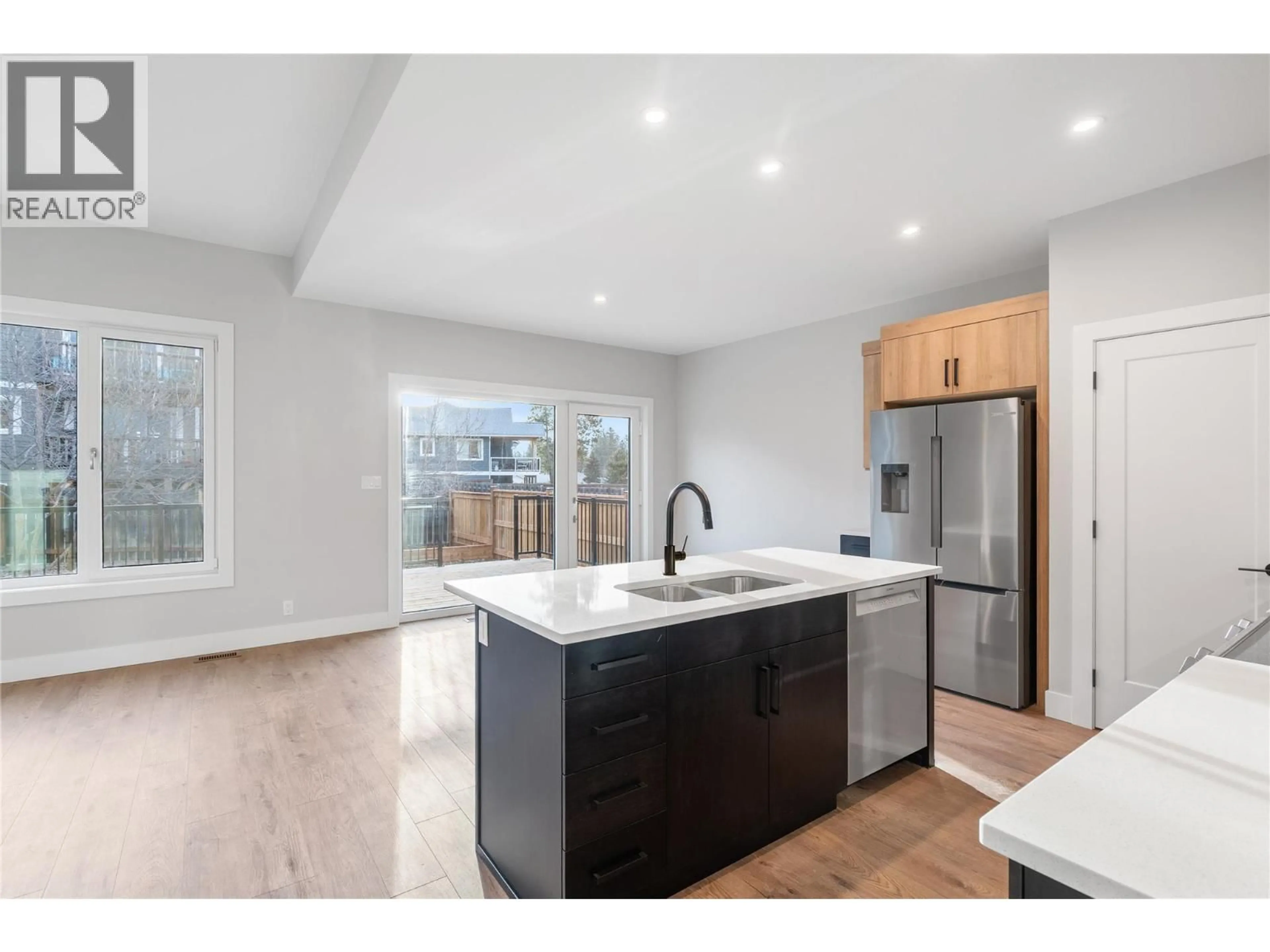 Open concept kitchen, wood/laminate floor for 726 ST MARY RIVER DRIVE, Kimberley British Columbia V1A3J4