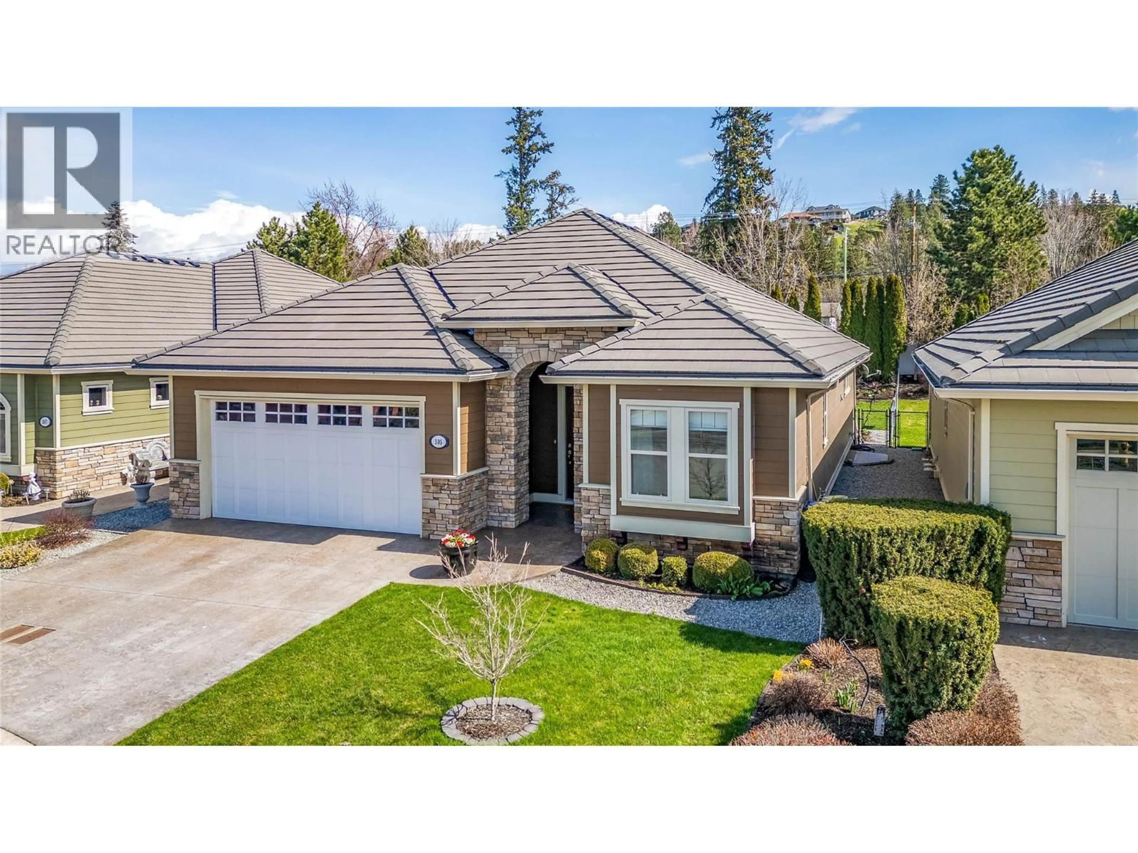 A pic from outside/outdoor area/front of a property/back of a property/a pic from drone, street for 105 - 4450 GORDON DRIVE, Kelowna British Columbia V1W1T1