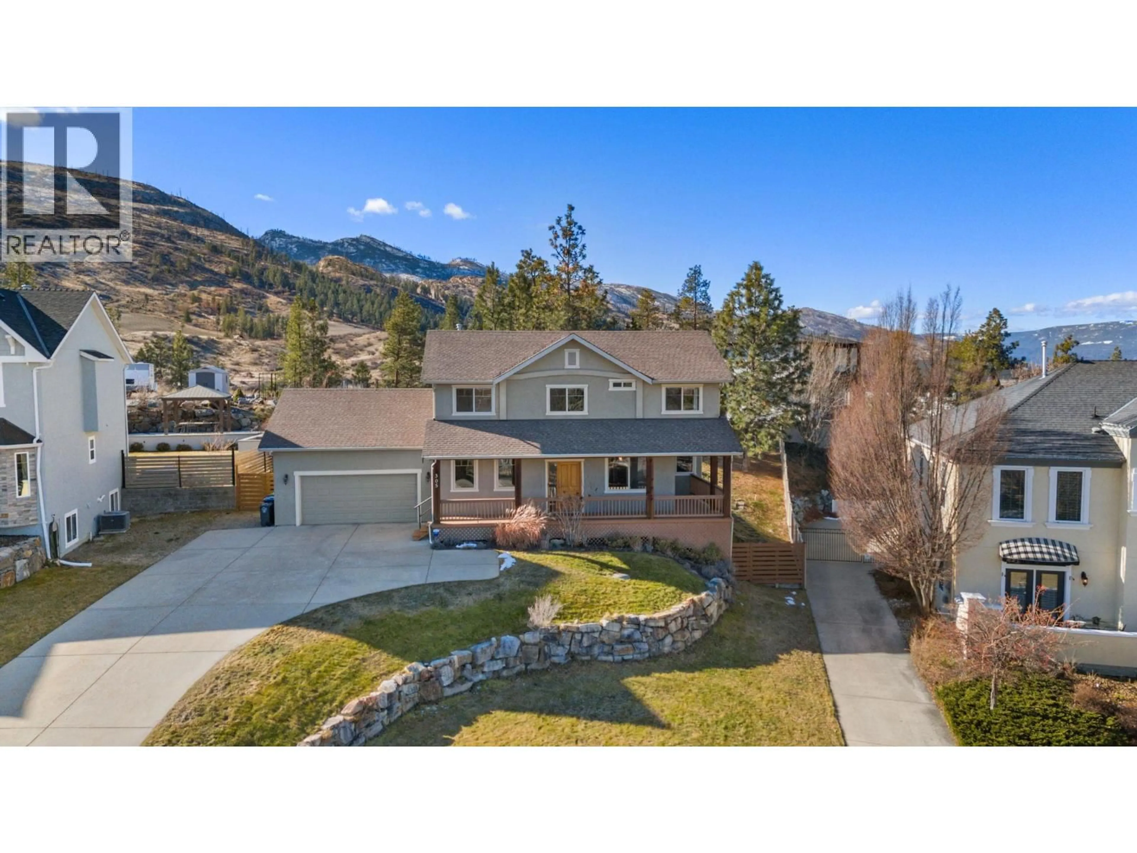 A pic from outside/outdoor area/front of a property/back of a property/a pic from drone, mountain view for 305 TANAGER DRIVE, Kelowna British Columbia V1W4K5