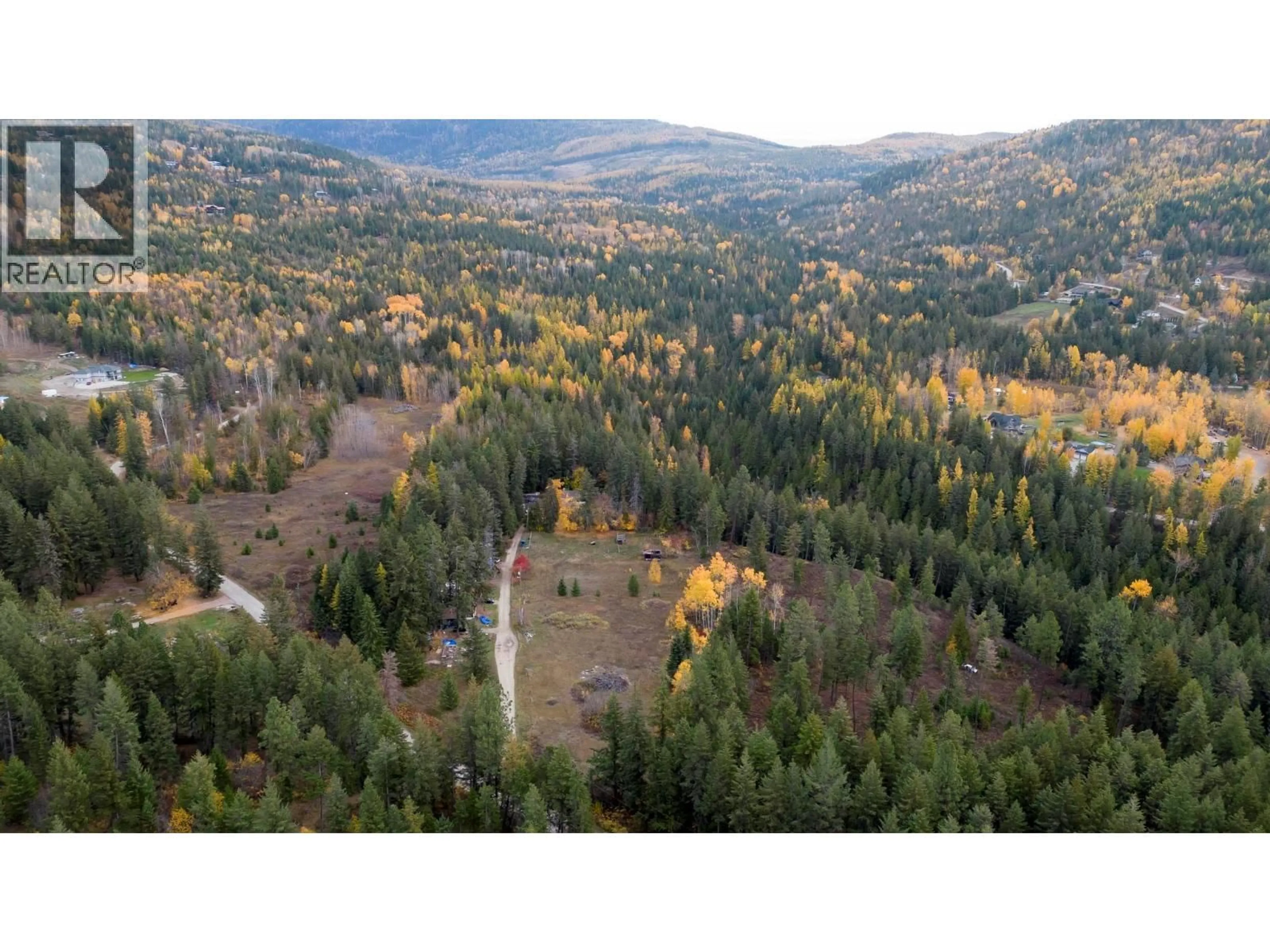 A pic from outside/outdoor area/front of a property/back of a property/a pic from drone, forest/trees view for 7948 WALLACE ROAD, Vernon British Columbia V1B3N2