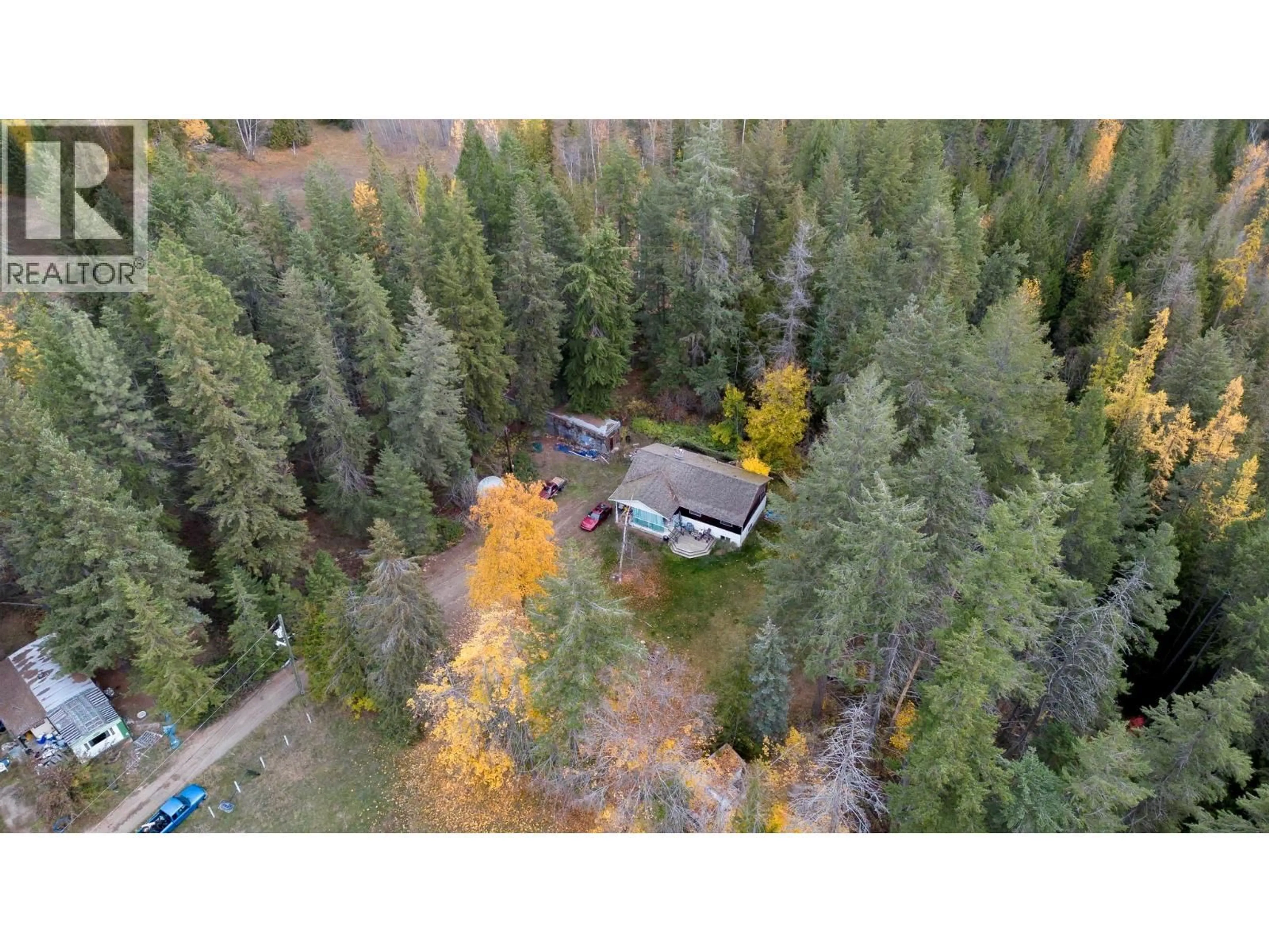 A pic from outside/outdoor area/front of a property/back of a property/a pic from drone, forest/trees view for 7948 WALLACE ROAD, Vernon British Columbia V1B3N2