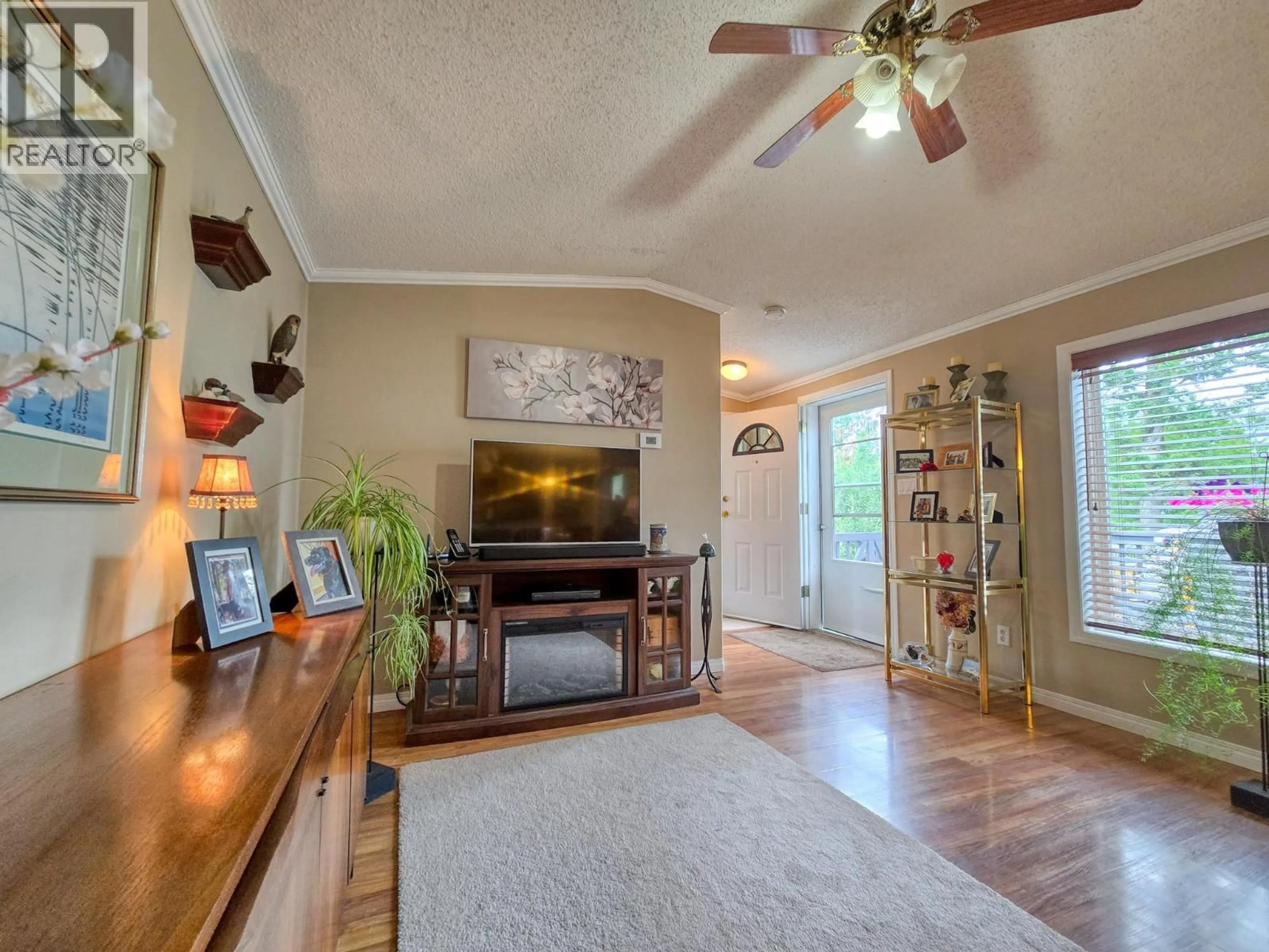 Living room with furniture, wood/laminate floor for 4789 RIVERVIEW DRIVE, Edgewater British Columbia V0A1E0