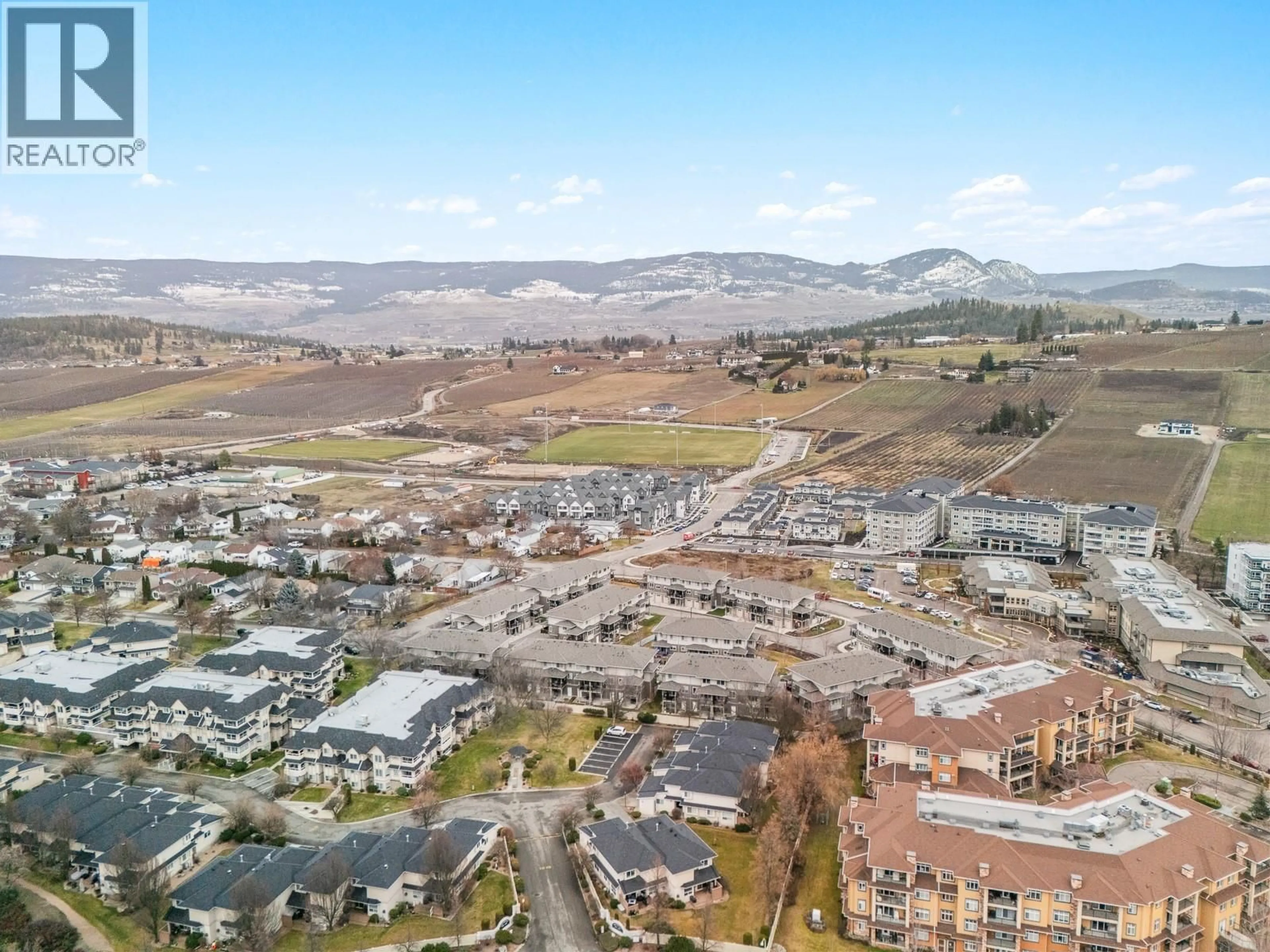 A pic from outside/outdoor area/front of a property/back of a property/a pic from drone, mountain view for 3 - 300 DRYSDALE BOULEVARD, Kelowna British Columbia V1V3E6