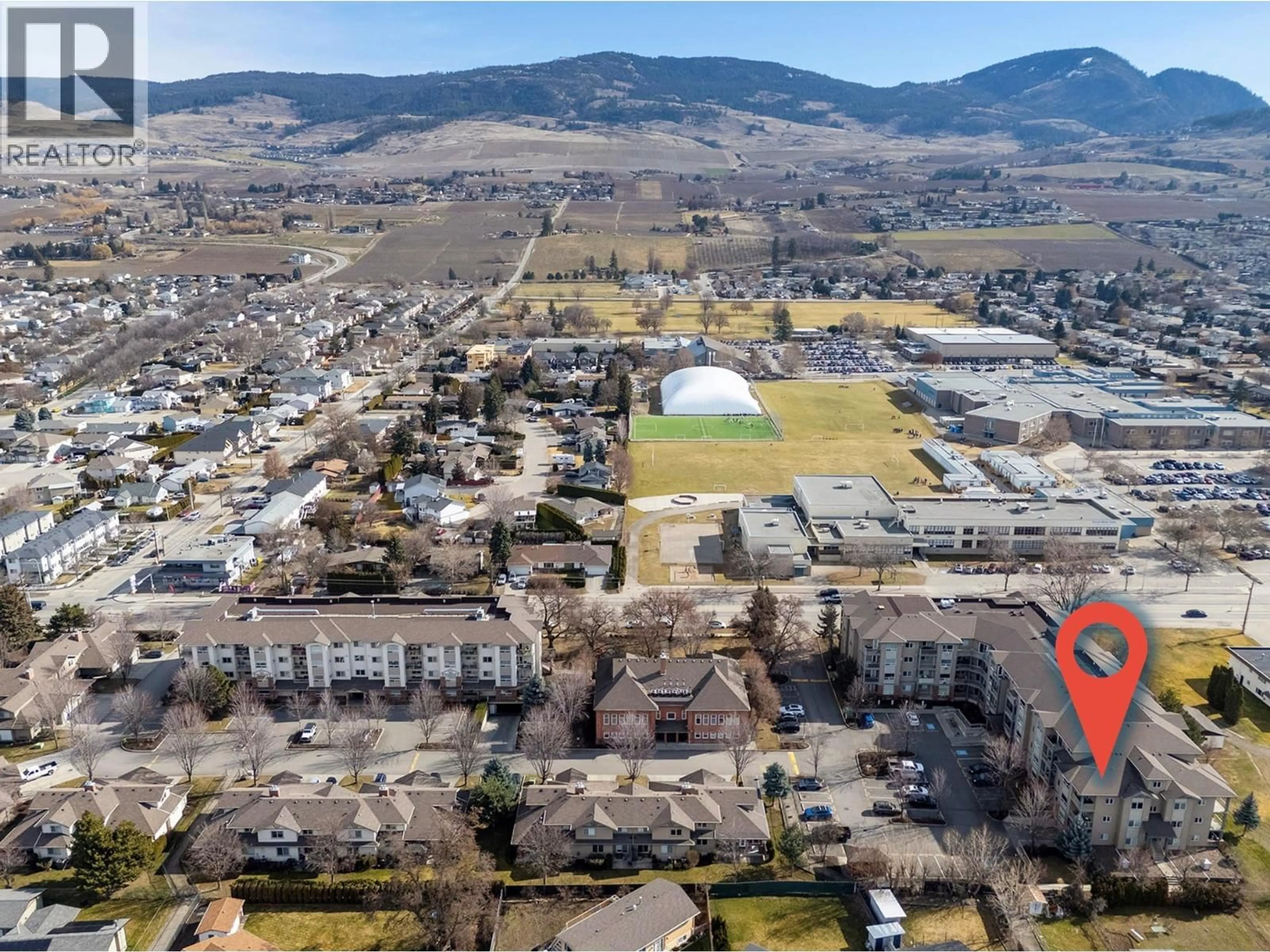 A pic from outside/outdoor area/front of a property/back of a property/a pic from drone, mountain view for 303 - 770 RUTLAND ROAD NORTH, Kelowna British Columbia V1X3B7
