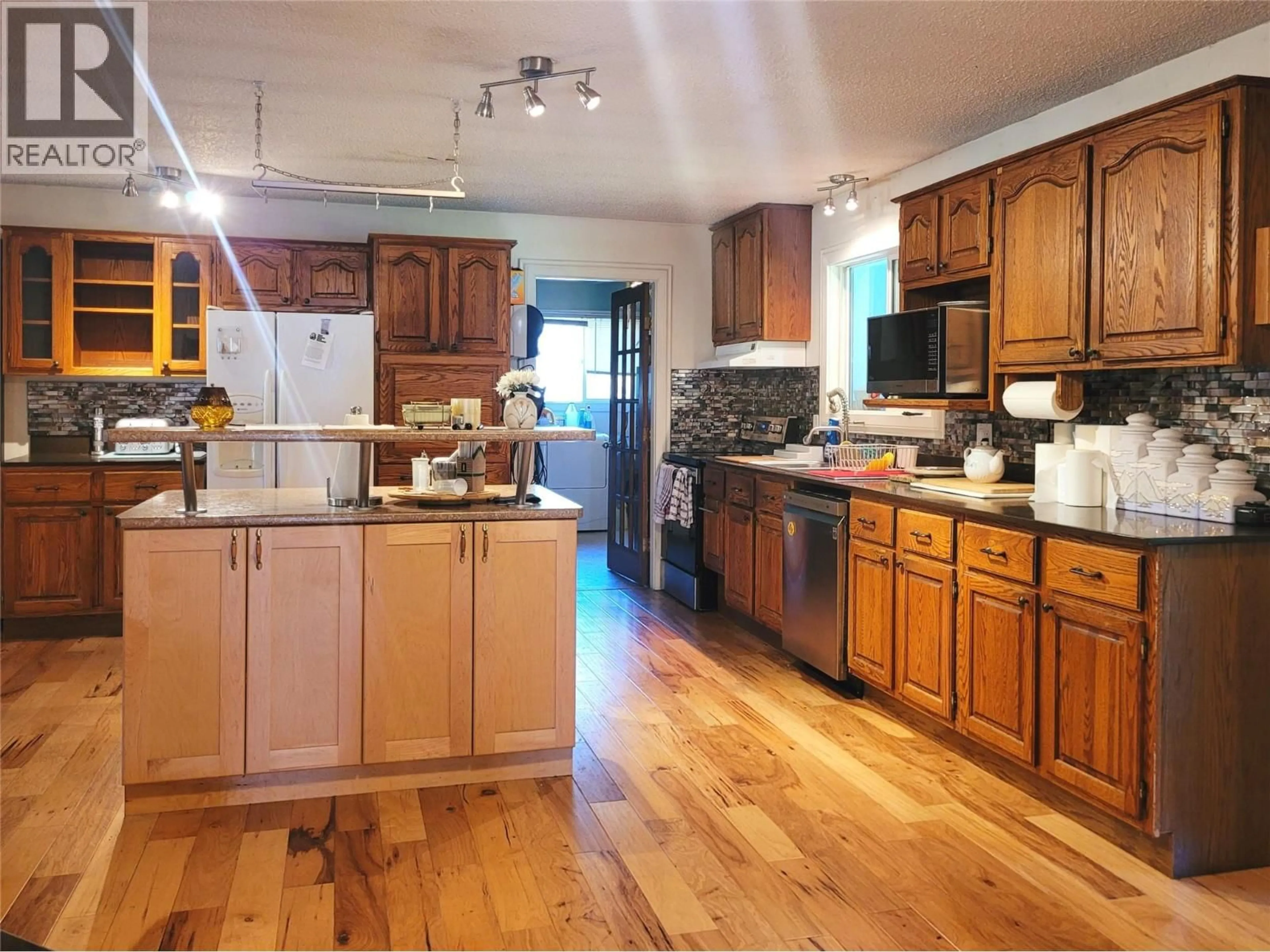 Open concept kitchen, wood/laminate floor for 1433 DAVY ROAD, Clearwater British Columbia V0E1N1