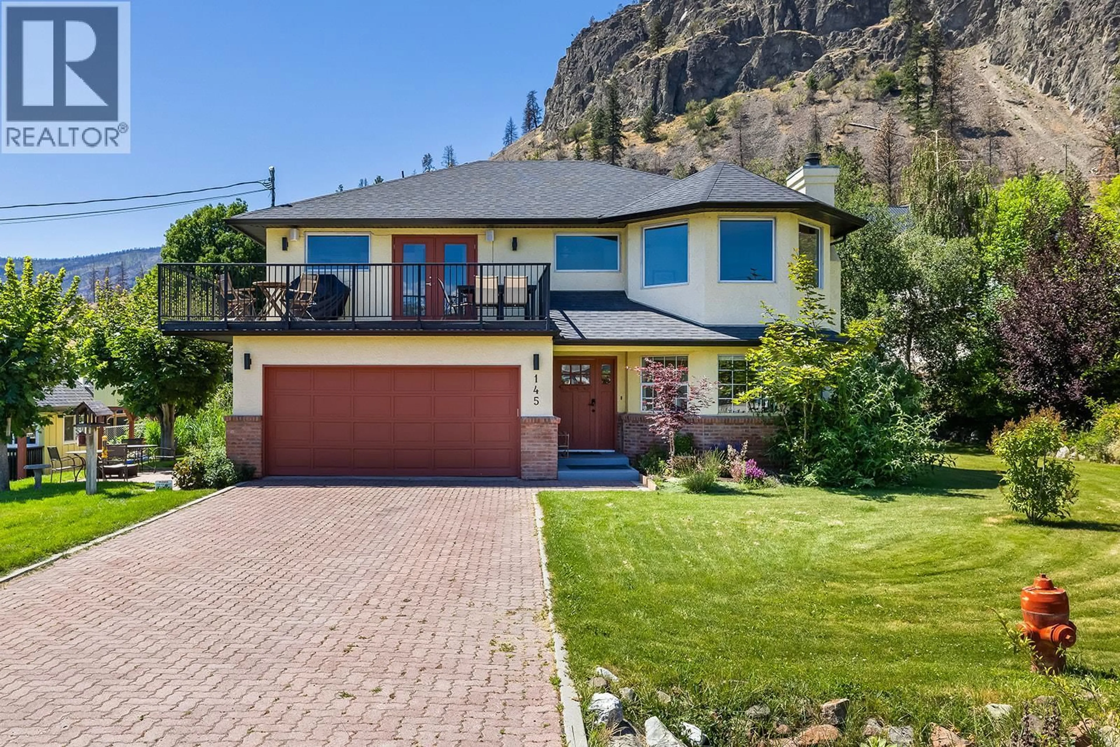 A pic from outside/outdoor area/front of a property/back of a property/a pic from drone, mountain view for 145 HELDON COURT, Kelowna British Columbia V1Z3S5