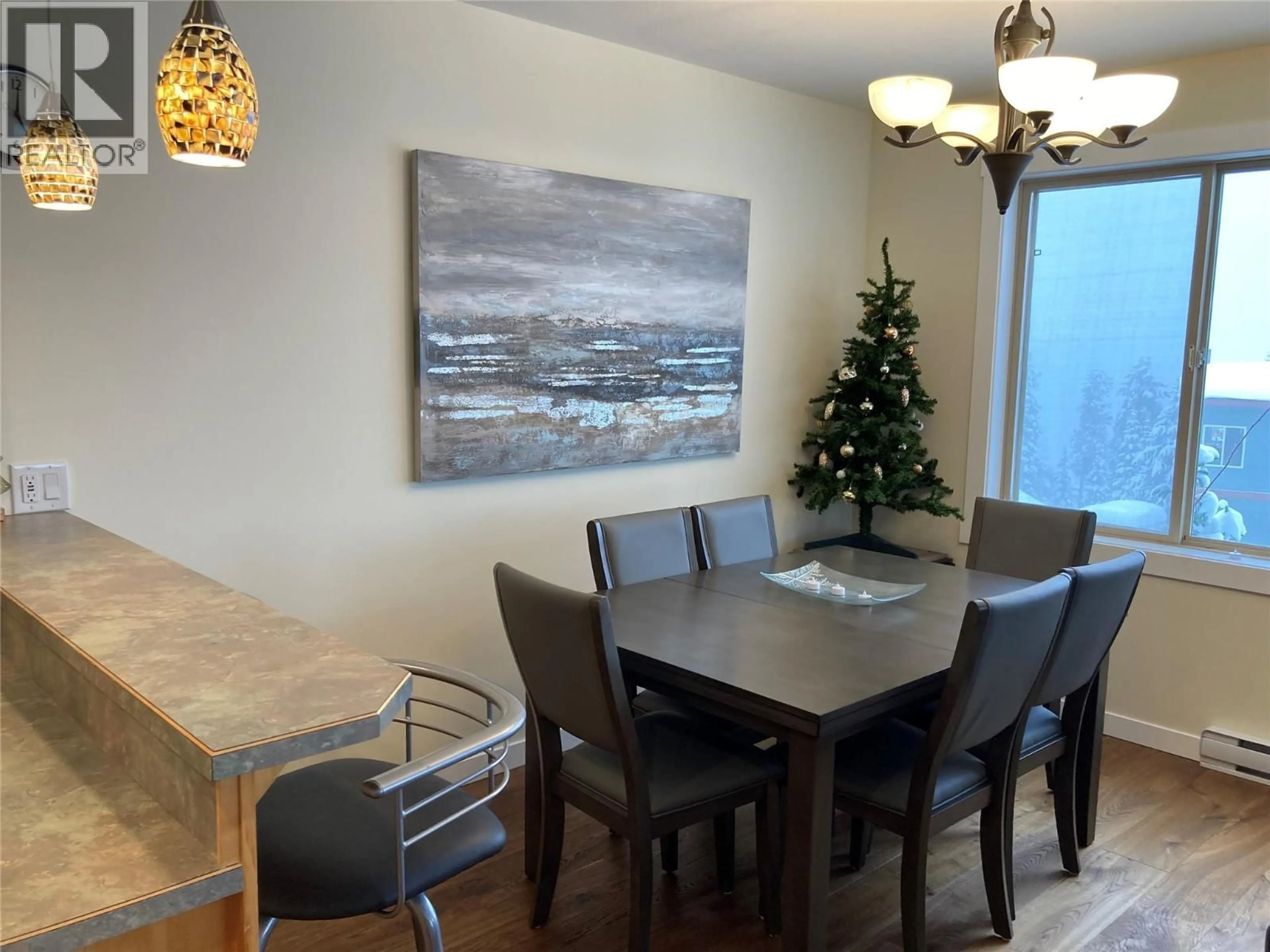Dining room, wood/laminate floor for C - 4820 SNOWPINES ROAD, Big White British Columbia V1P1P3