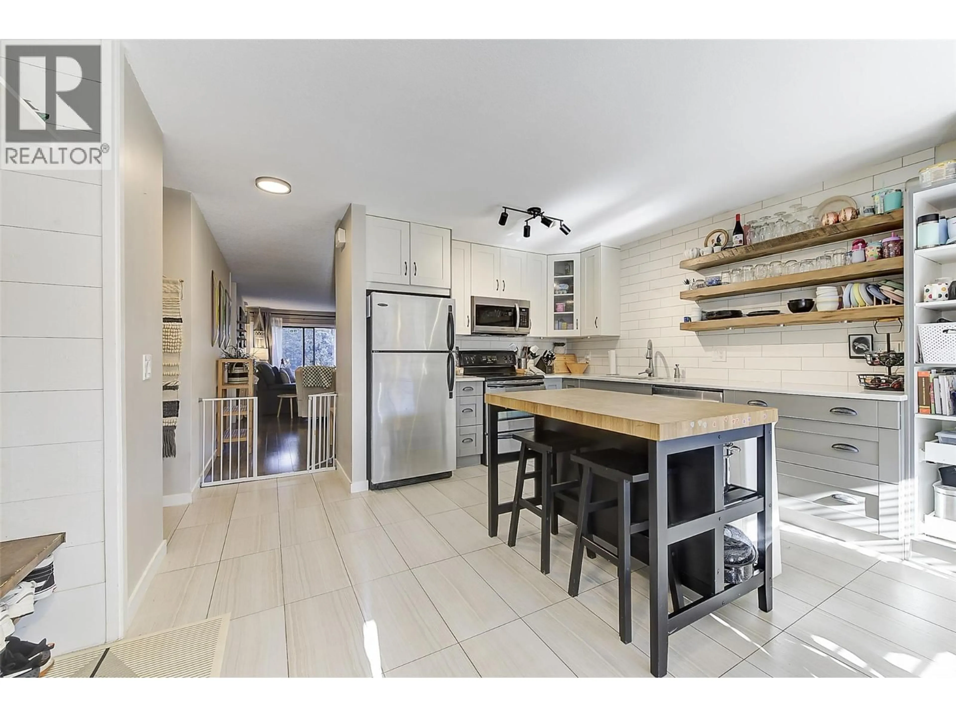 Open concept kitchen, ceramic/tile floor for 101 - 290 MILLS ROAD, Kelowna British Columbia V1X4G8