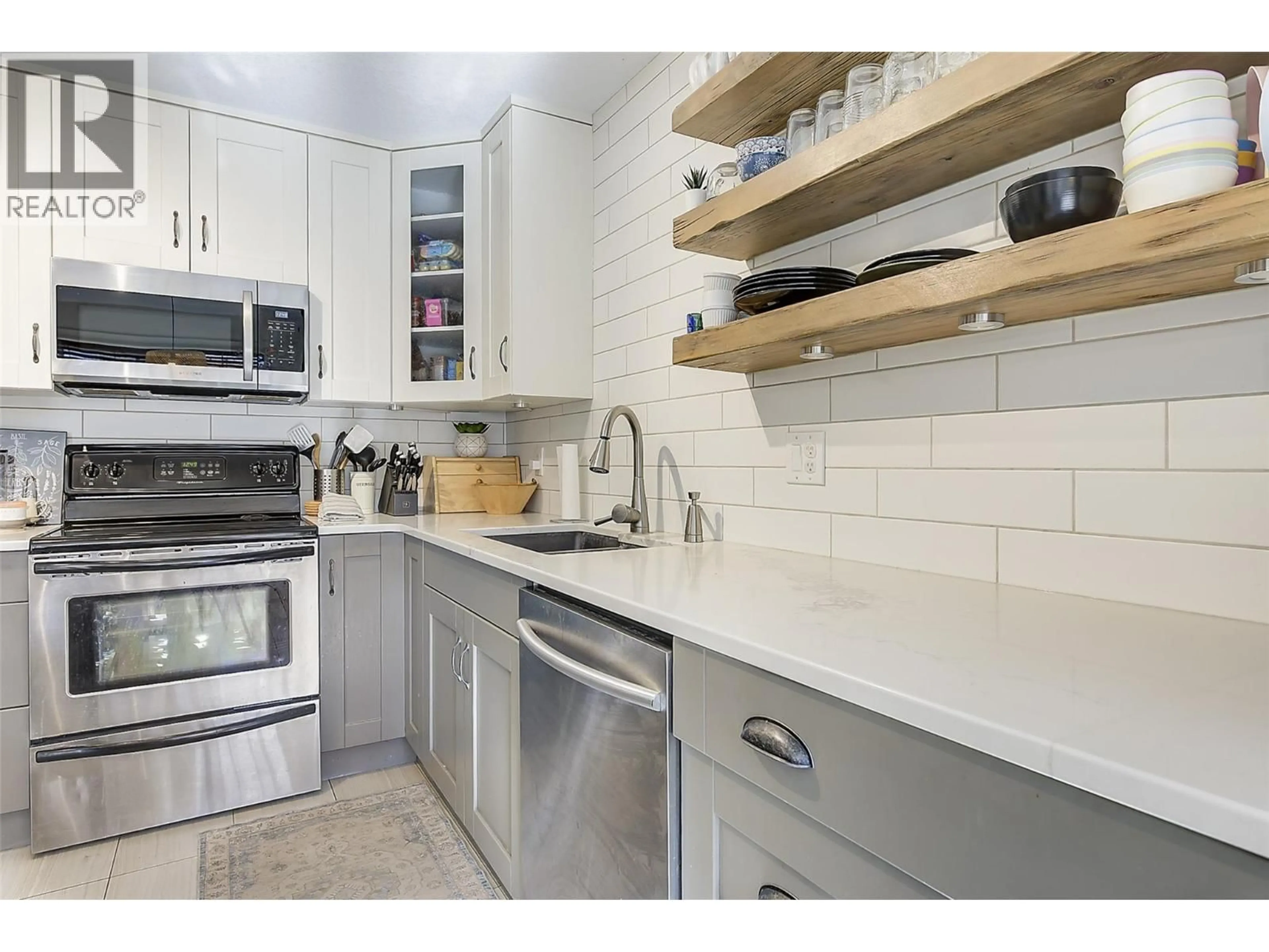 Open concept kitchen, ceramic/tile floor for 101 - 290 MILLS ROAD, Kelowna British Columbia V1X4G8