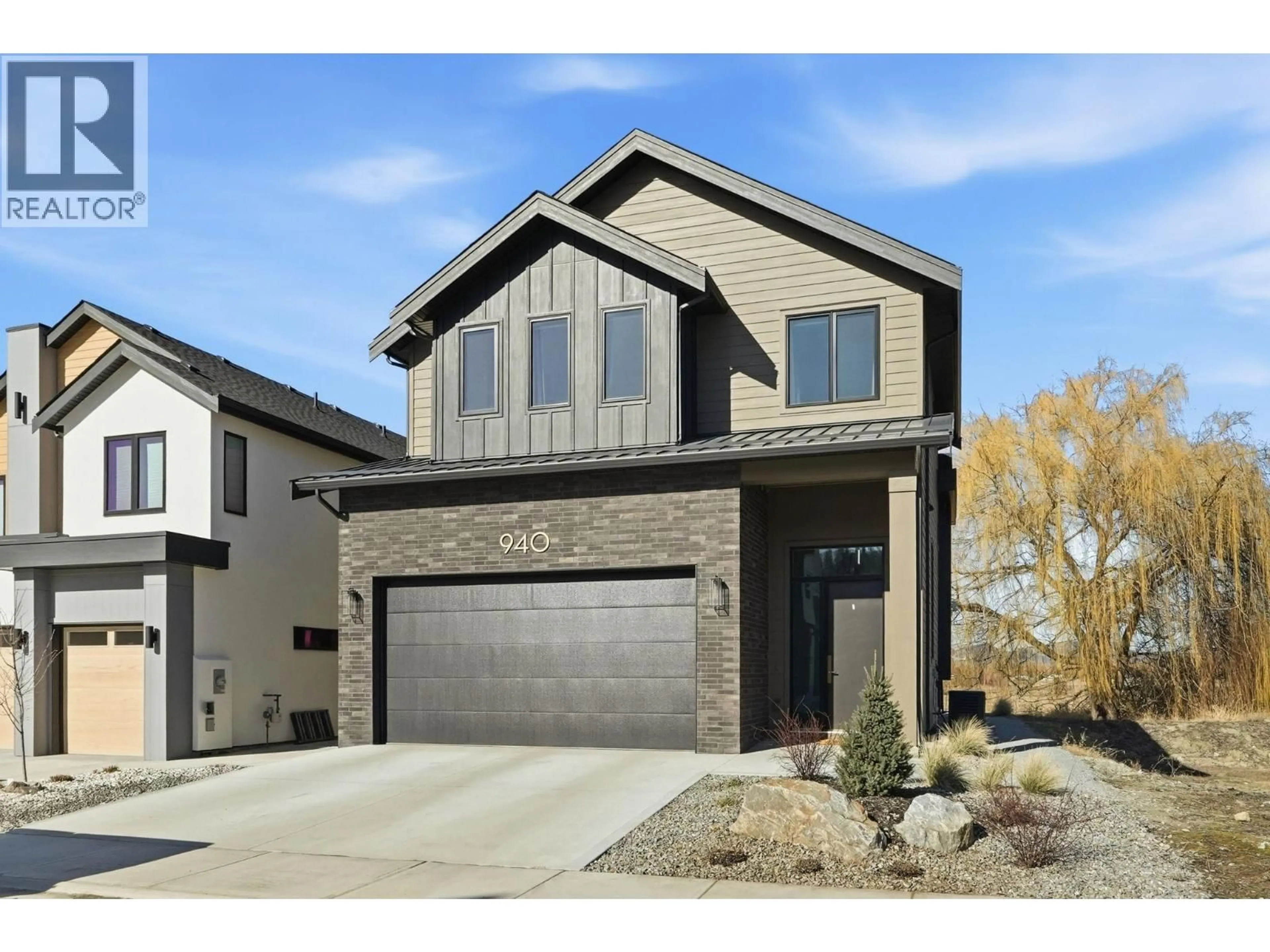 Home with brick exterior material, street for 940 BULL CRESCENT, Kelowna British Columbia V1W4N2