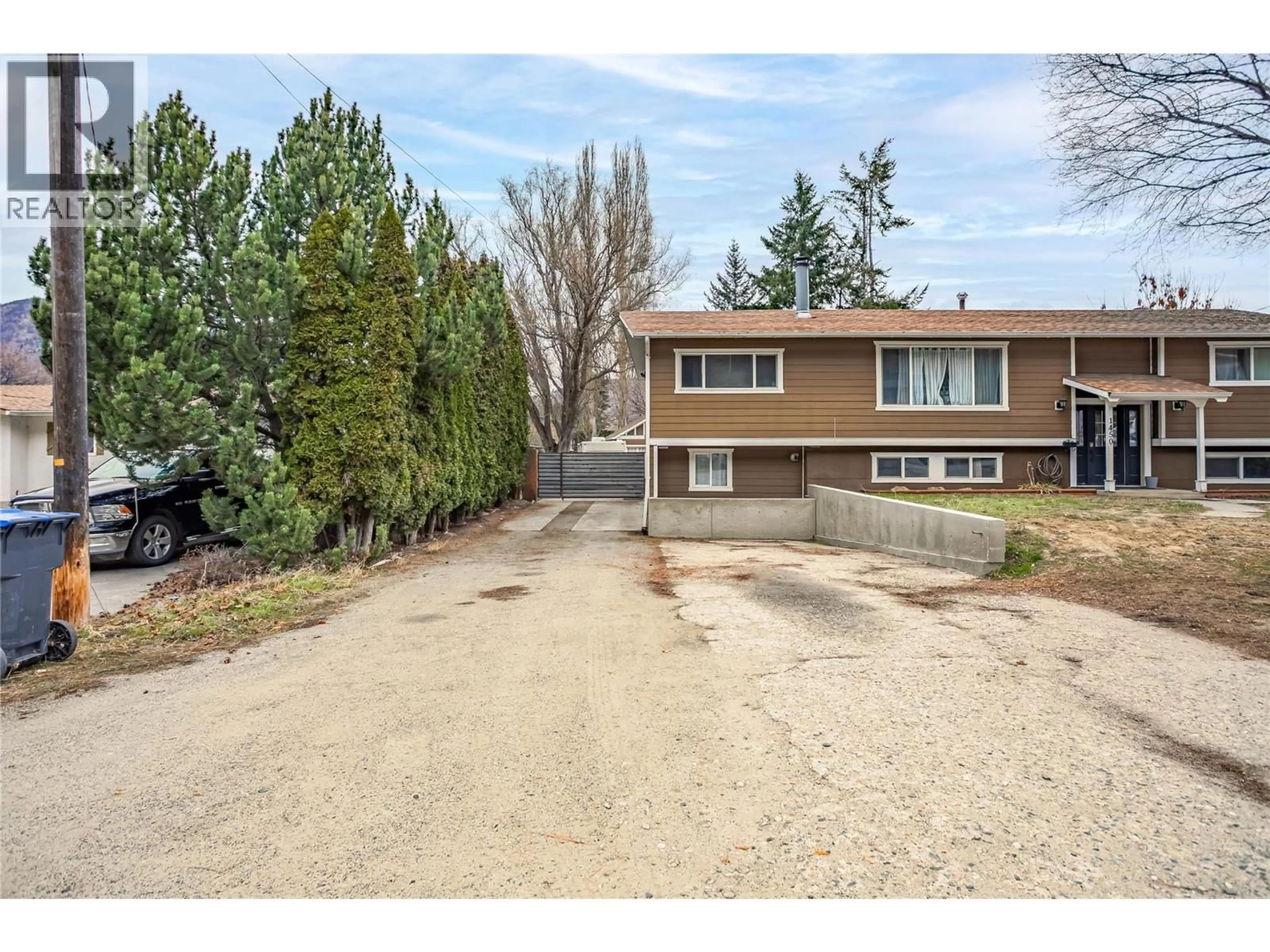 A pic from outside/outdoor area/front of a property/back of a property/a pic from drone, street for 1450 PONDEROSA ROAD, West Kelowna British Columbia V1Z1N1