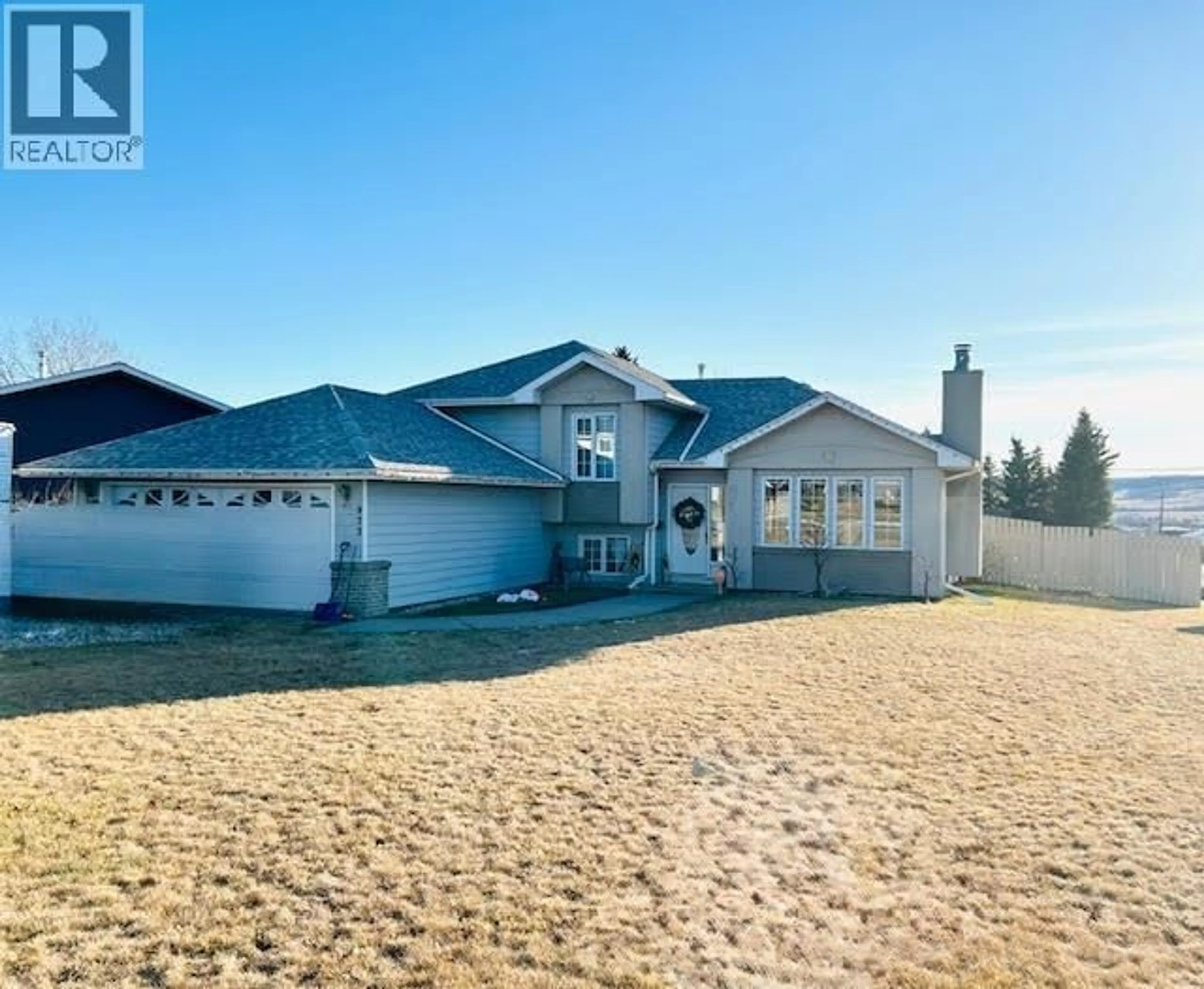 A pic from outside/outdoor area/front of a property/back of a property/a pic from drone, water/lake/river/ocean view for 973 CORNWALL CRESCENT, Dawson Creek British Columbia V1G1P1