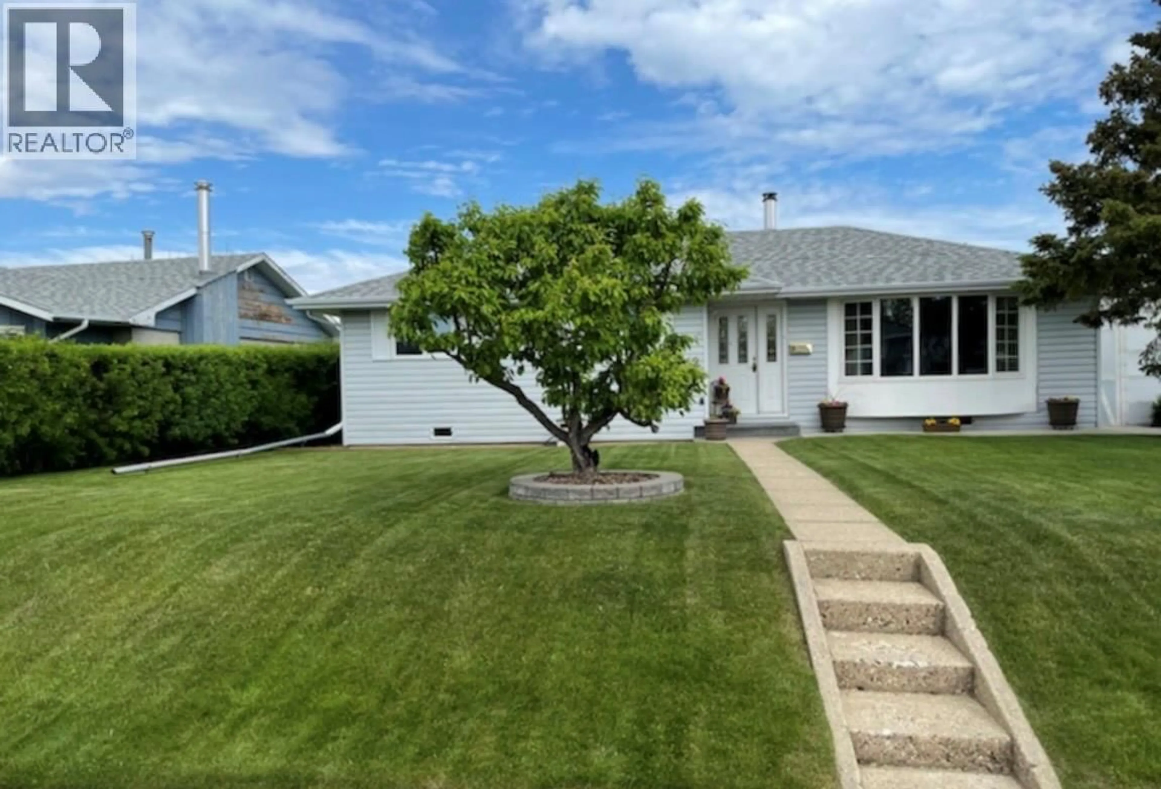 A pic from outside/outdoor area/front of a property/back of a property/a pic from drone, street for 11112 14A STREET, Dawson Creek British Columbia V1G3Y7