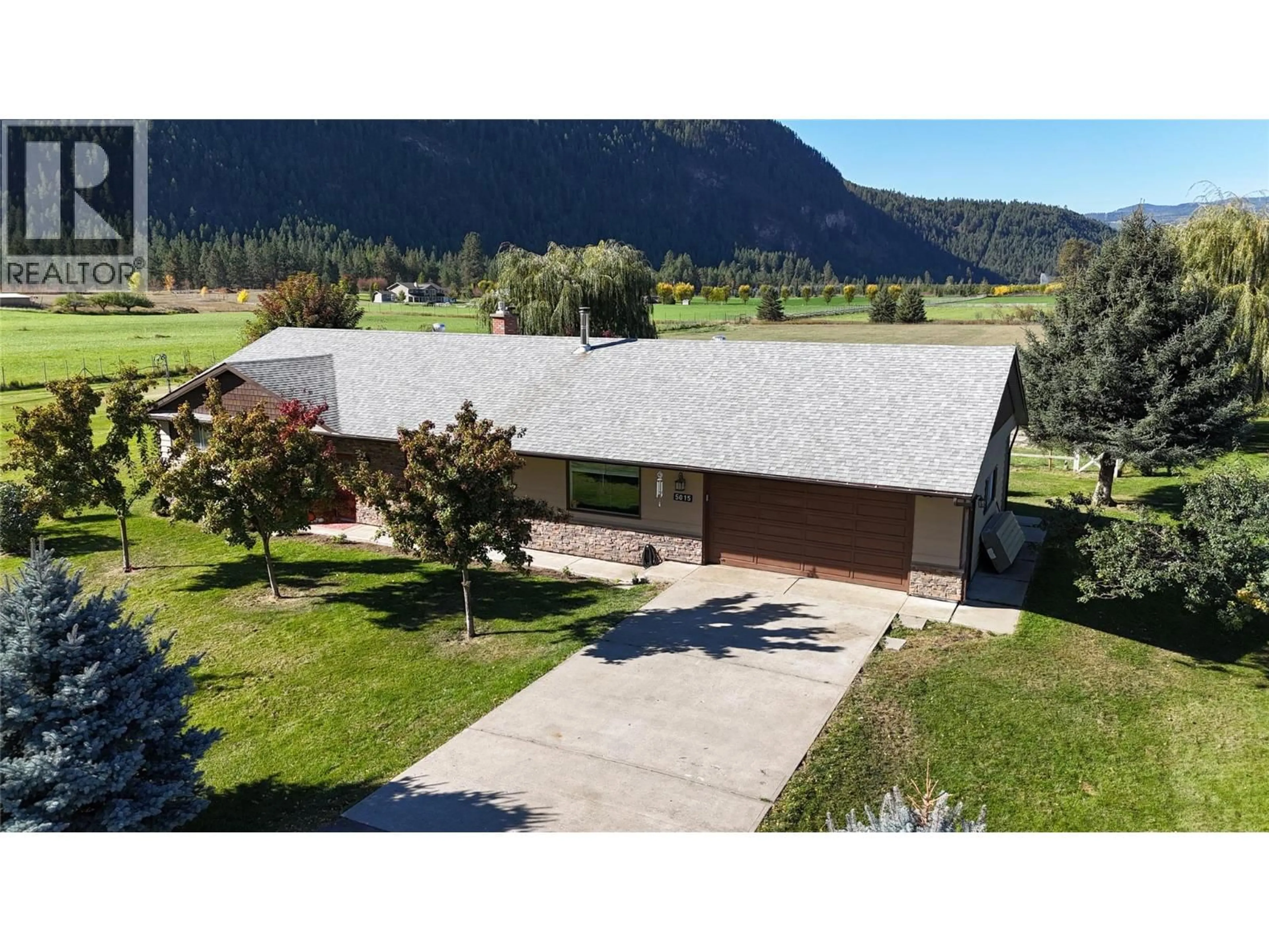 A pic from outside/outdoor area/front of a property/back of a property/a pic from drone, mountain view for 5015 SIMINOFF ROAD, Grand Forks British Columbia V0H1H4