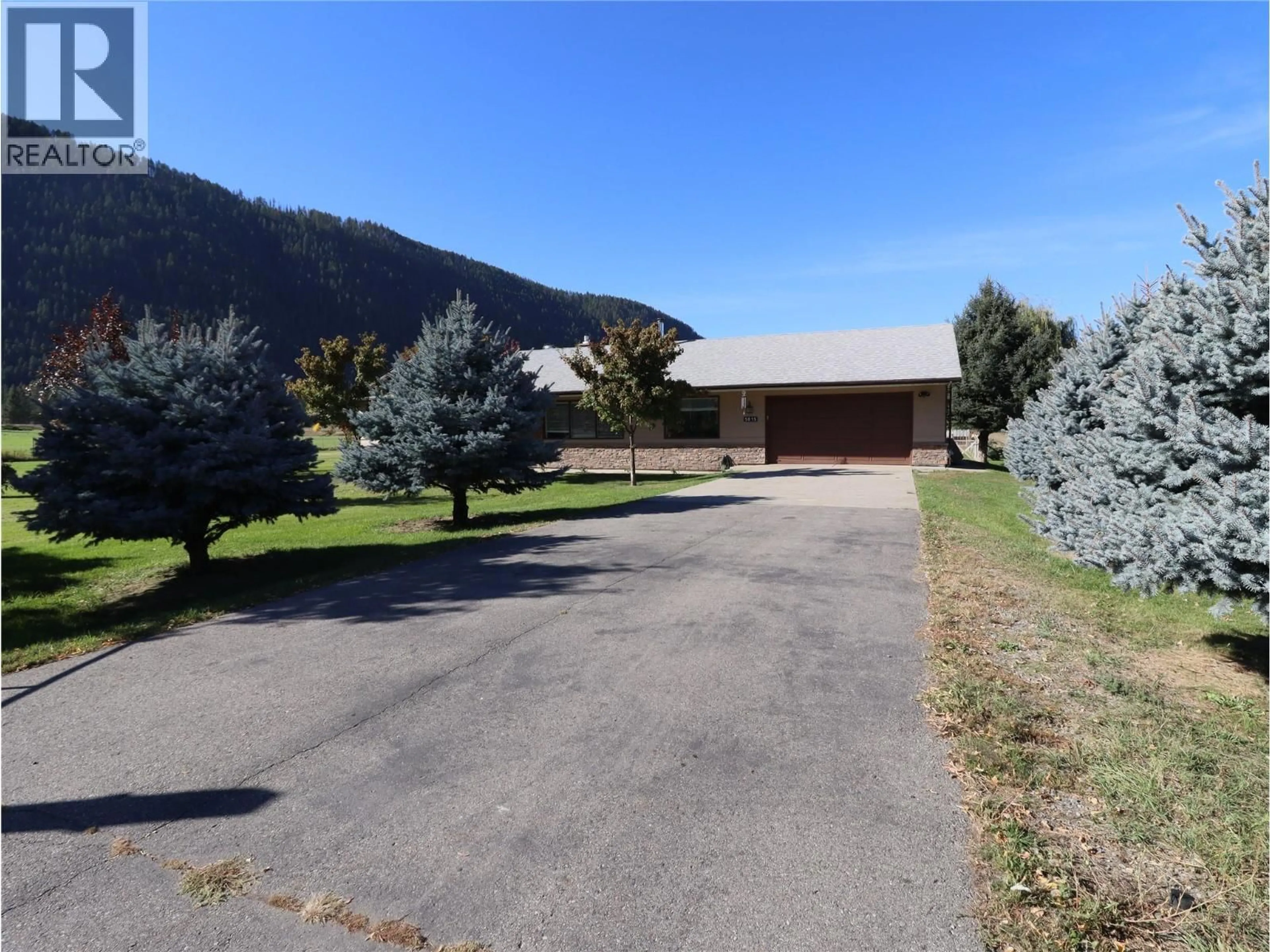 A pic from outside/outdoor area/front of a property/back of a property/a pic from drone, mountain view for 5015 SIMINOFF ROAD, Grand Forks British Columbia V0H1H4