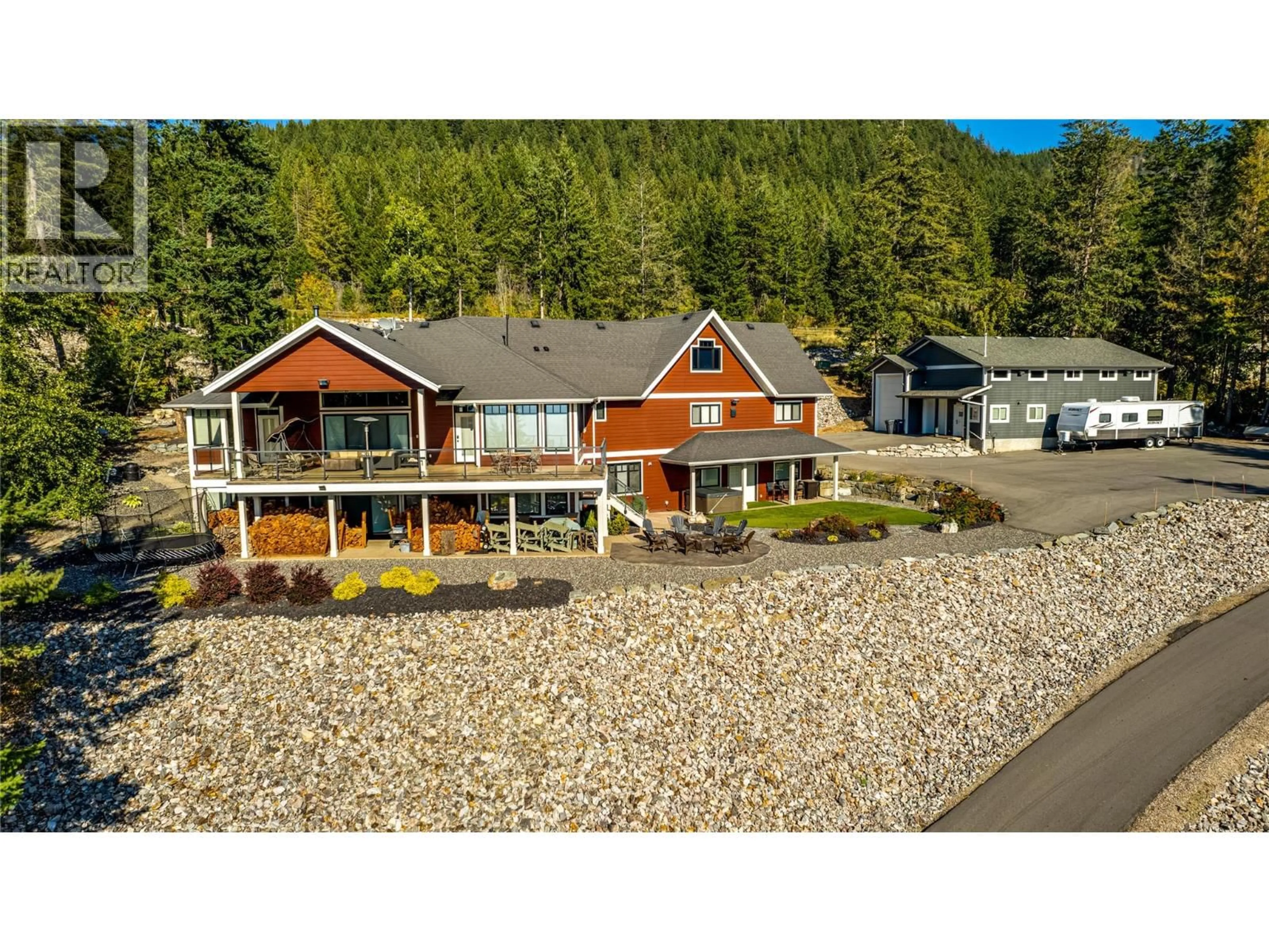 A pic from outside/outdoor area/front of a property/back of a property/a pic from drone, water/lake/river/ocean view for 6054 LYNX DRIVE, Vernon British Columbia V1B3J5