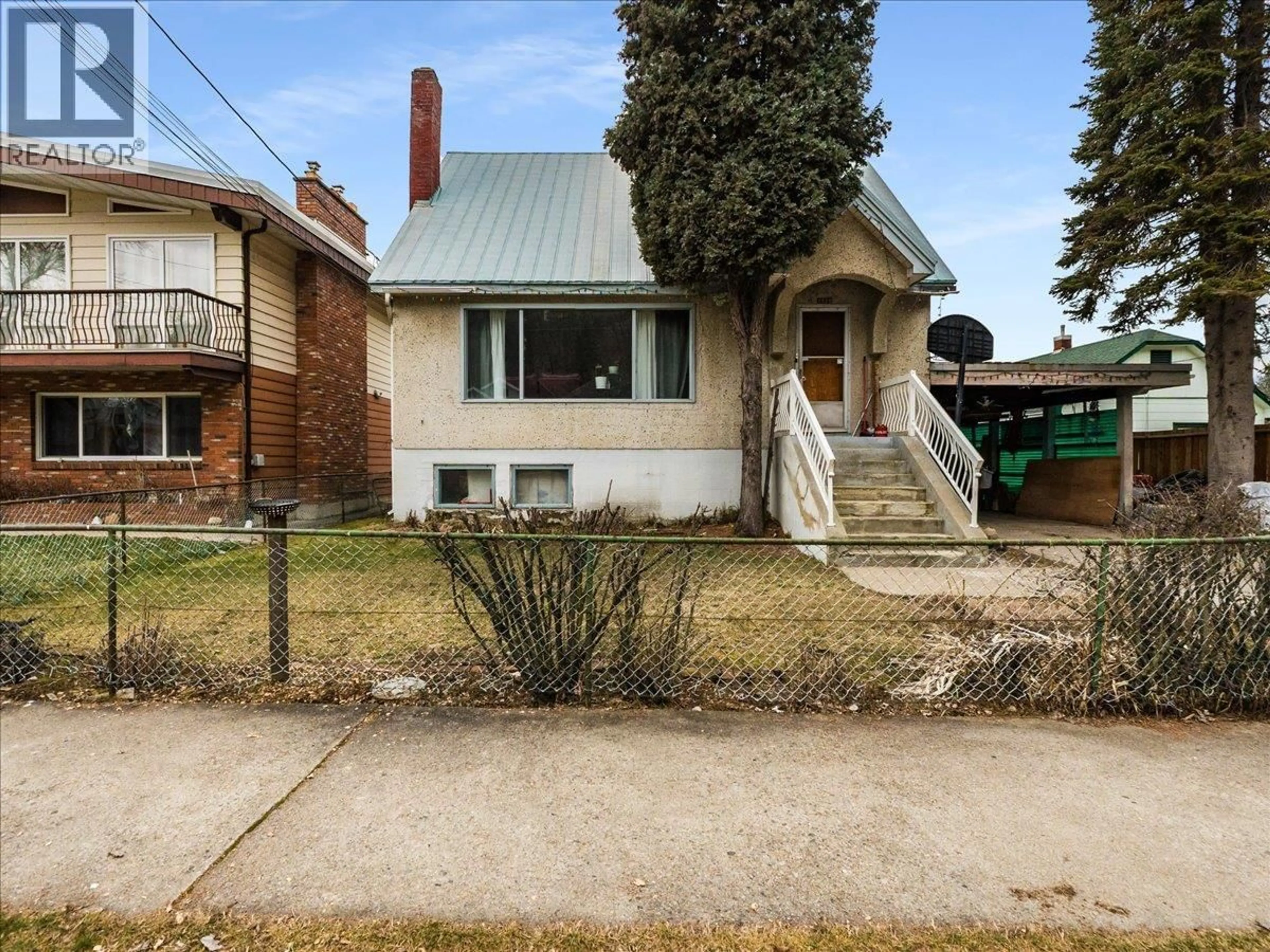 Home with brick exterior material, street for 1220 THIRD AVENUE, Trail British Columbia V1R1P2