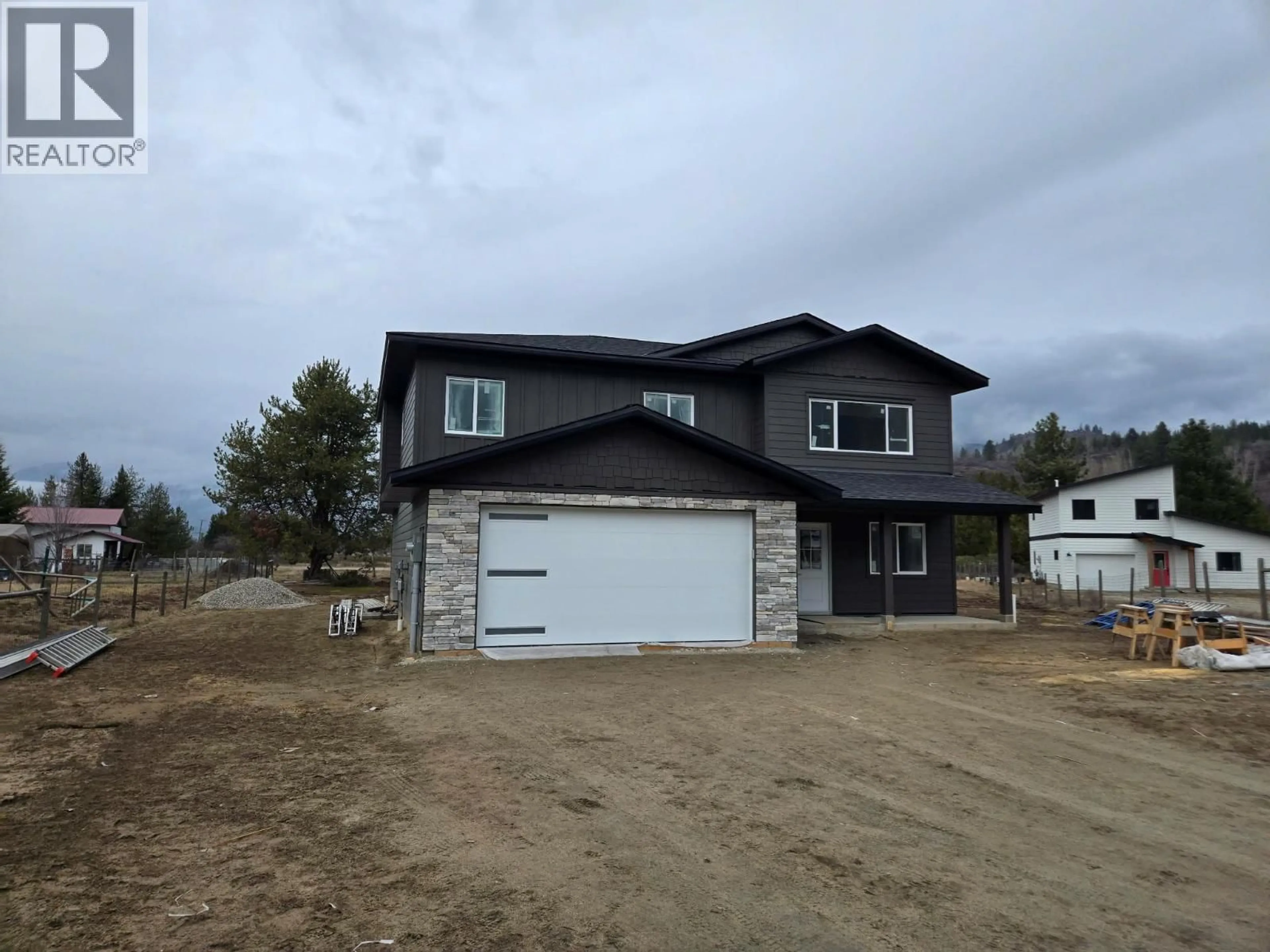 Home with vinyl exterior material, street for 319 ELKVIEW TRAIL, Castlegar British Columbia V1N4L5