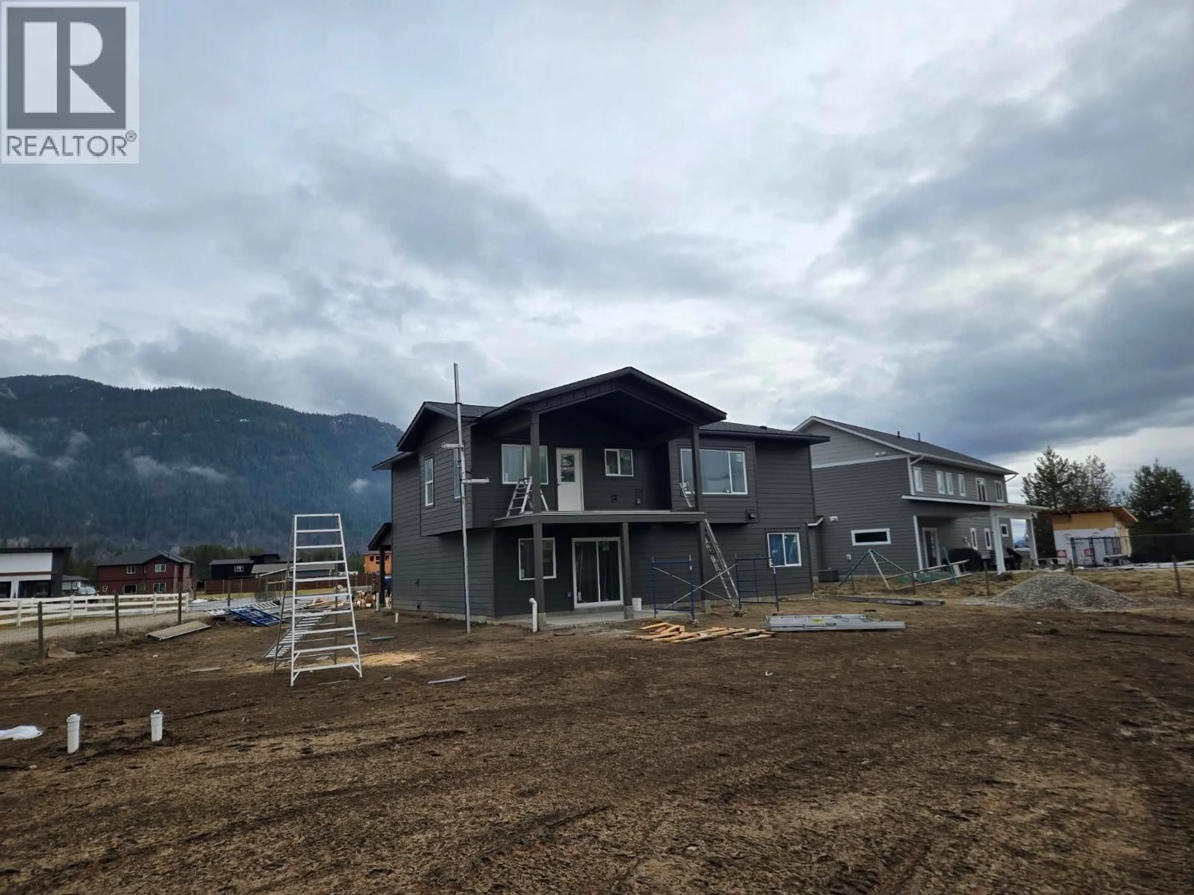 A pic from outside/outdoor area/front of a property/back of a property/a pic from drone, mountain view for 319 ELKVIEW TRAIL, Castlegar British Columbia V1N4L5