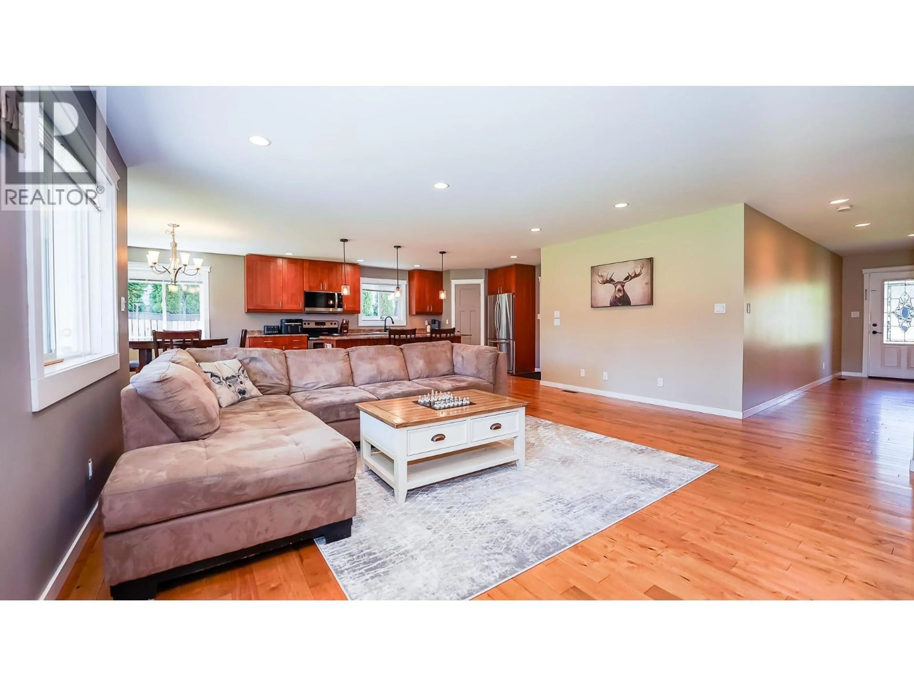Living room with furniture, wood/laminate floor for 810 11 STREET SOUTHEAST, Salmon Arm British Columbia V1E1R3
