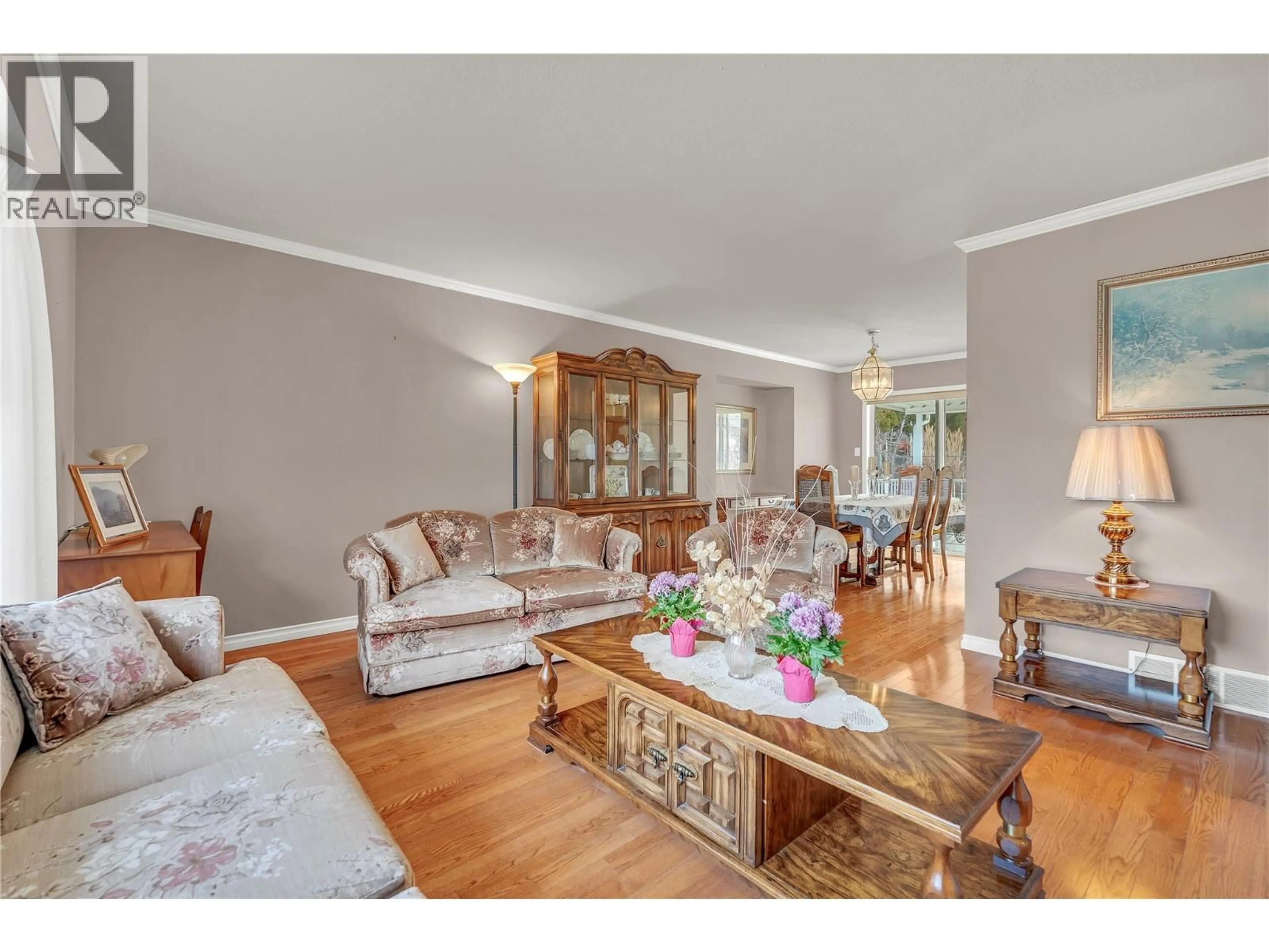 Living room with furniture, wood/laminate floor for 136 ROGERS CRESCENT, Penticton British Columbia V2A8E6