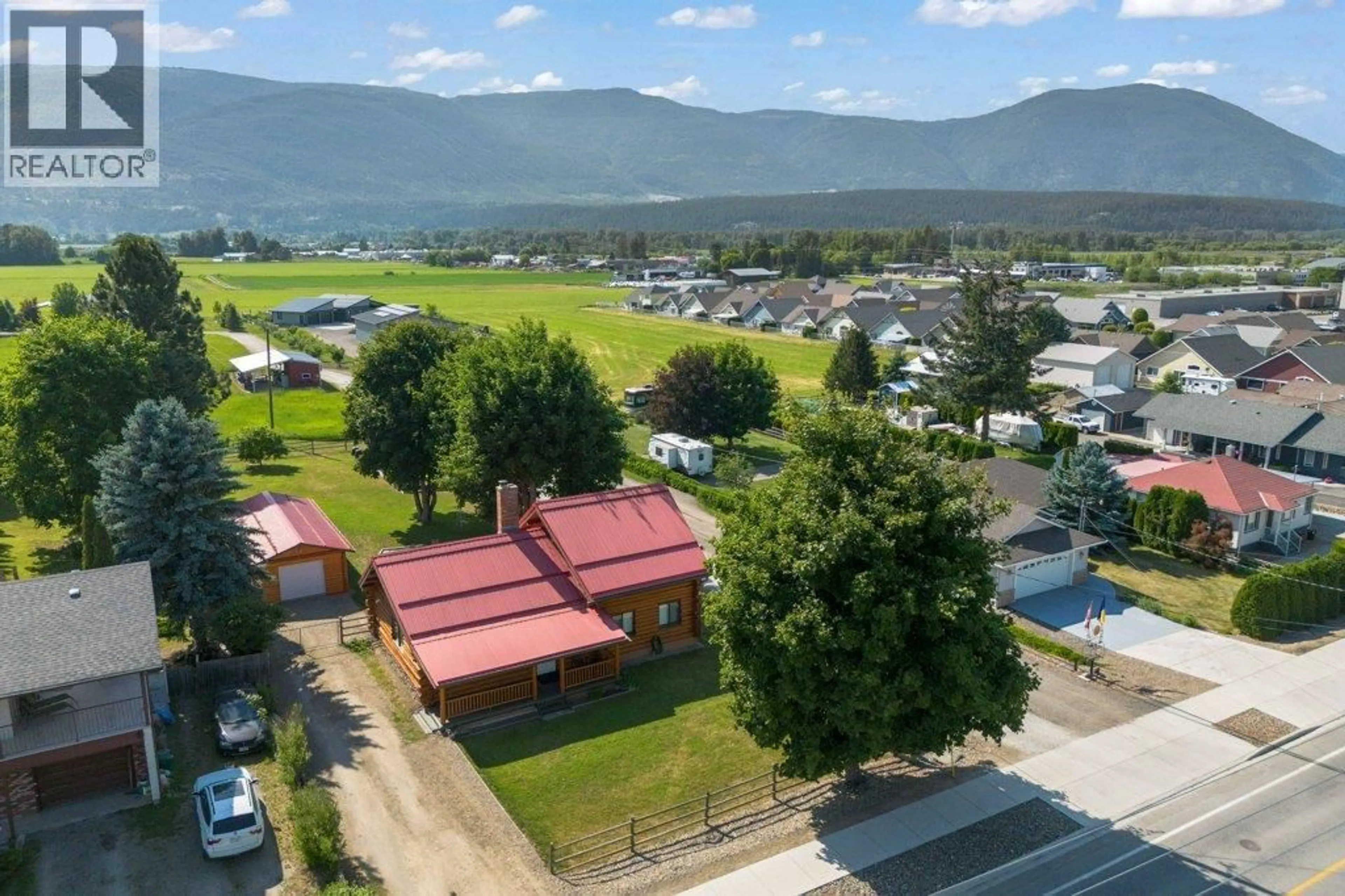 A pic from outside/outdoor area/front of a property/back of a property/a pic from drone, mountain view for 1421 10 STREET SOUTHWEST, Salmon Arm British Columbia V1E1T2