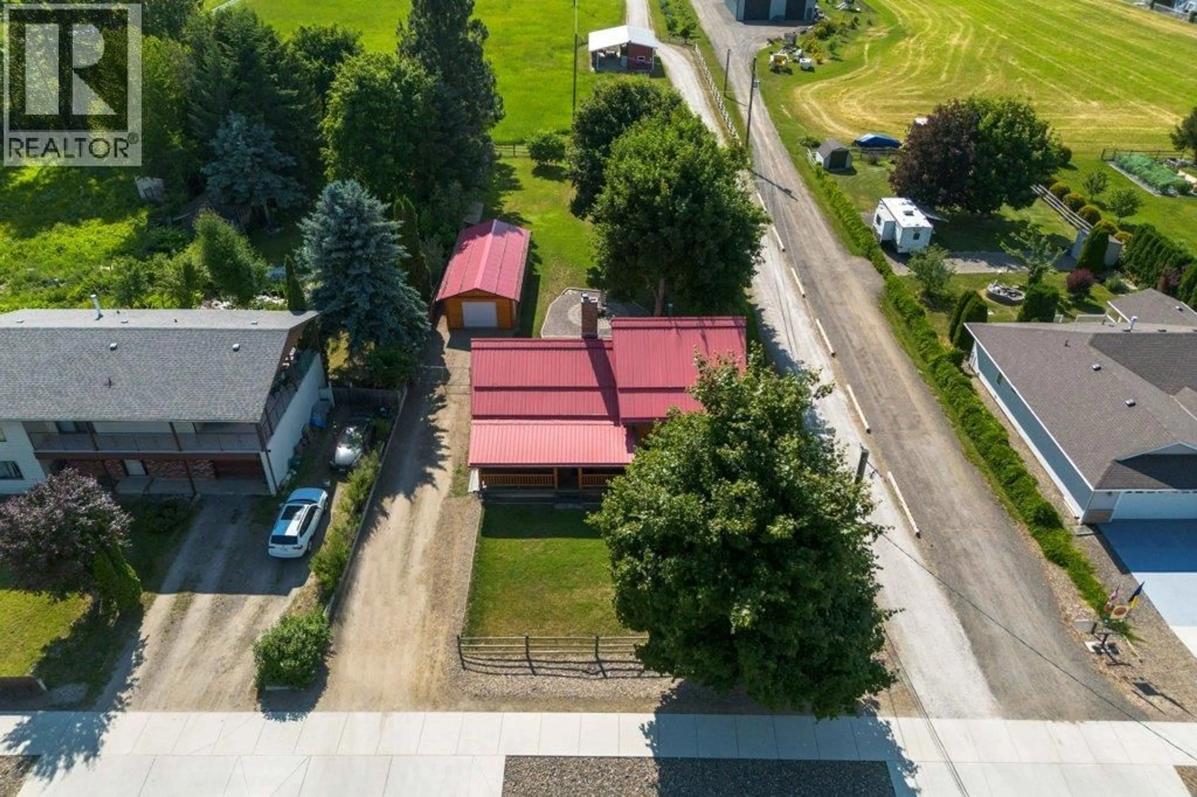 A pic from outside/outdoor area/front of a property/back of a property/a pic from drone, street for 1421 10 STREET SOUTHWEST, Salmon Arm British Columbia V1E1T2