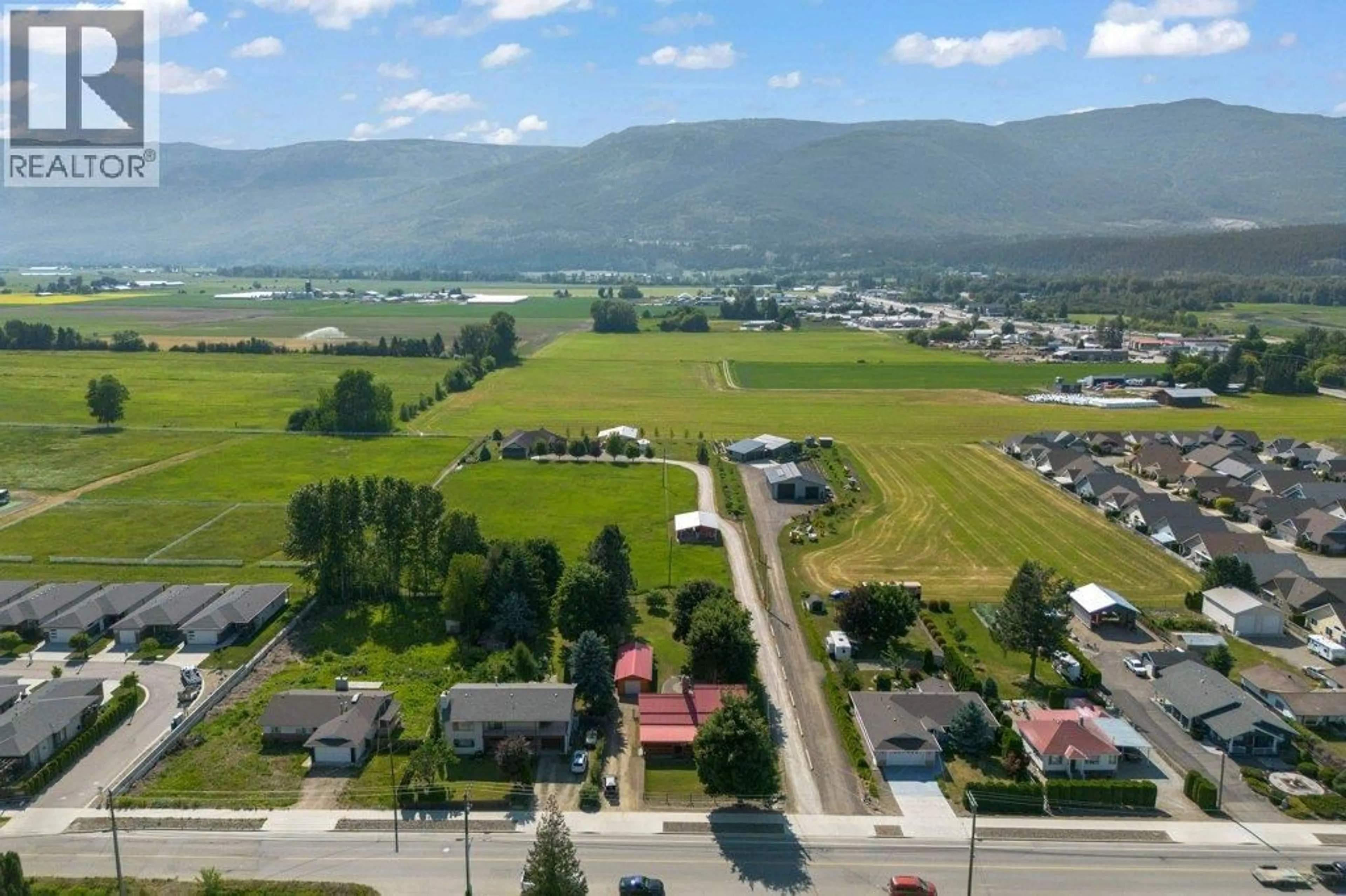 A pic from outside/outdoor area/front of a property/back of a property/a pic from drone, mountain view for 1421 10 STREET SOUTHWEST, Salmon Arm British Columbia V1E1T2
