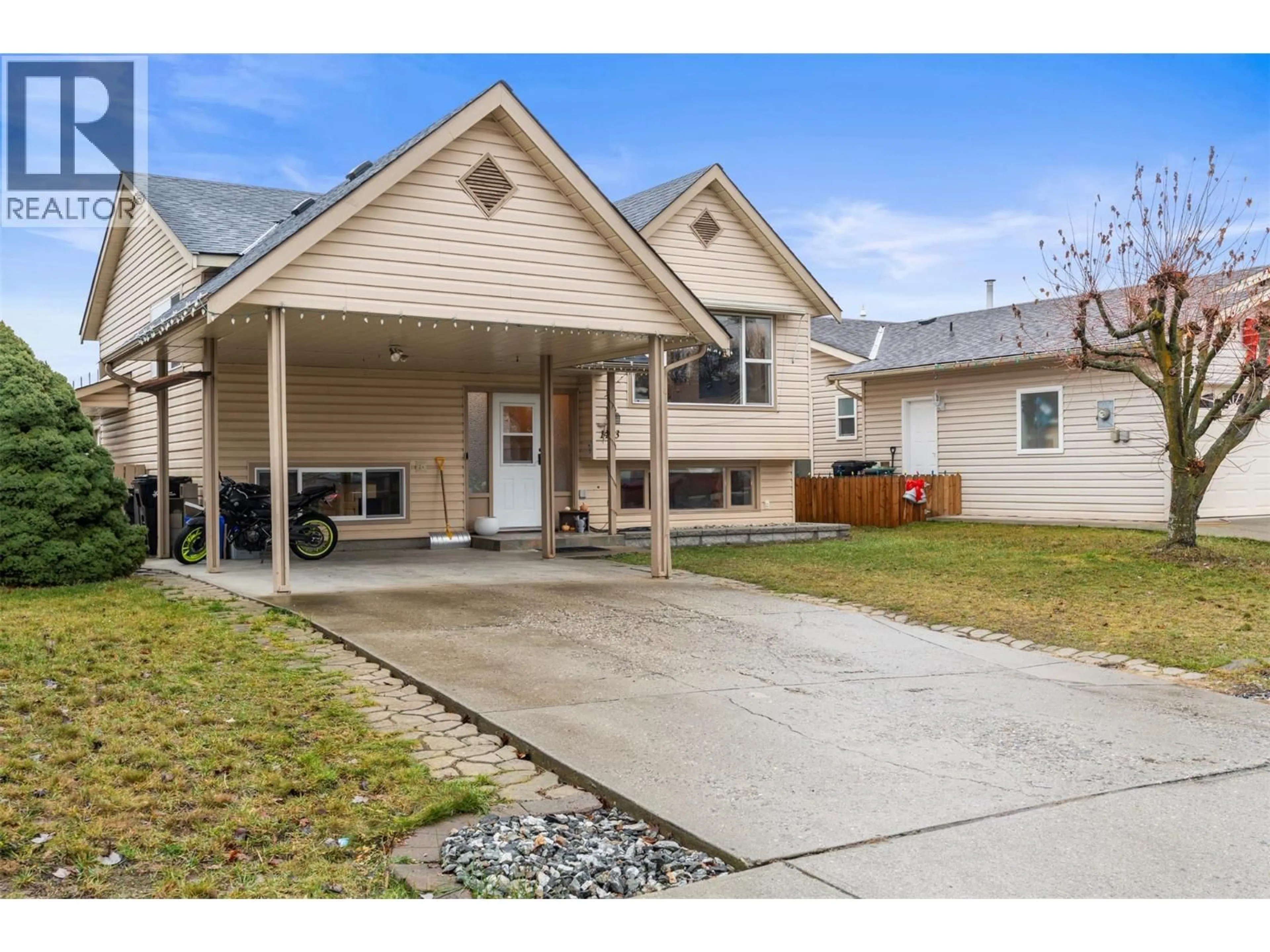 Home with vinyl exterior material, street for 1413 12TH STREET, Vernon British Columbia V1T2S6