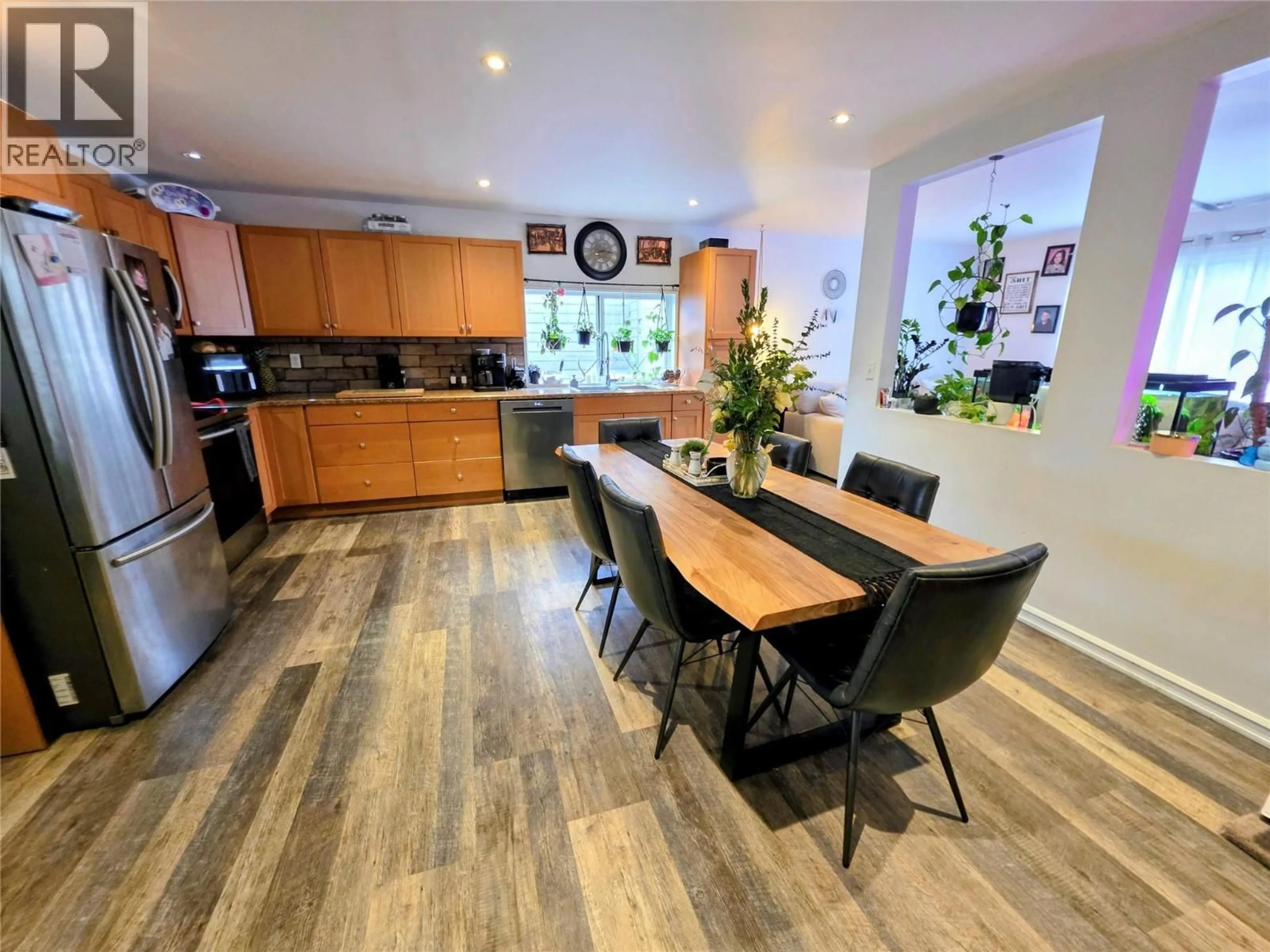 Open concept kitchen, wood/laminate floor for 101 PINE AVENUE, Fruitvale British Columbia V0G1L0