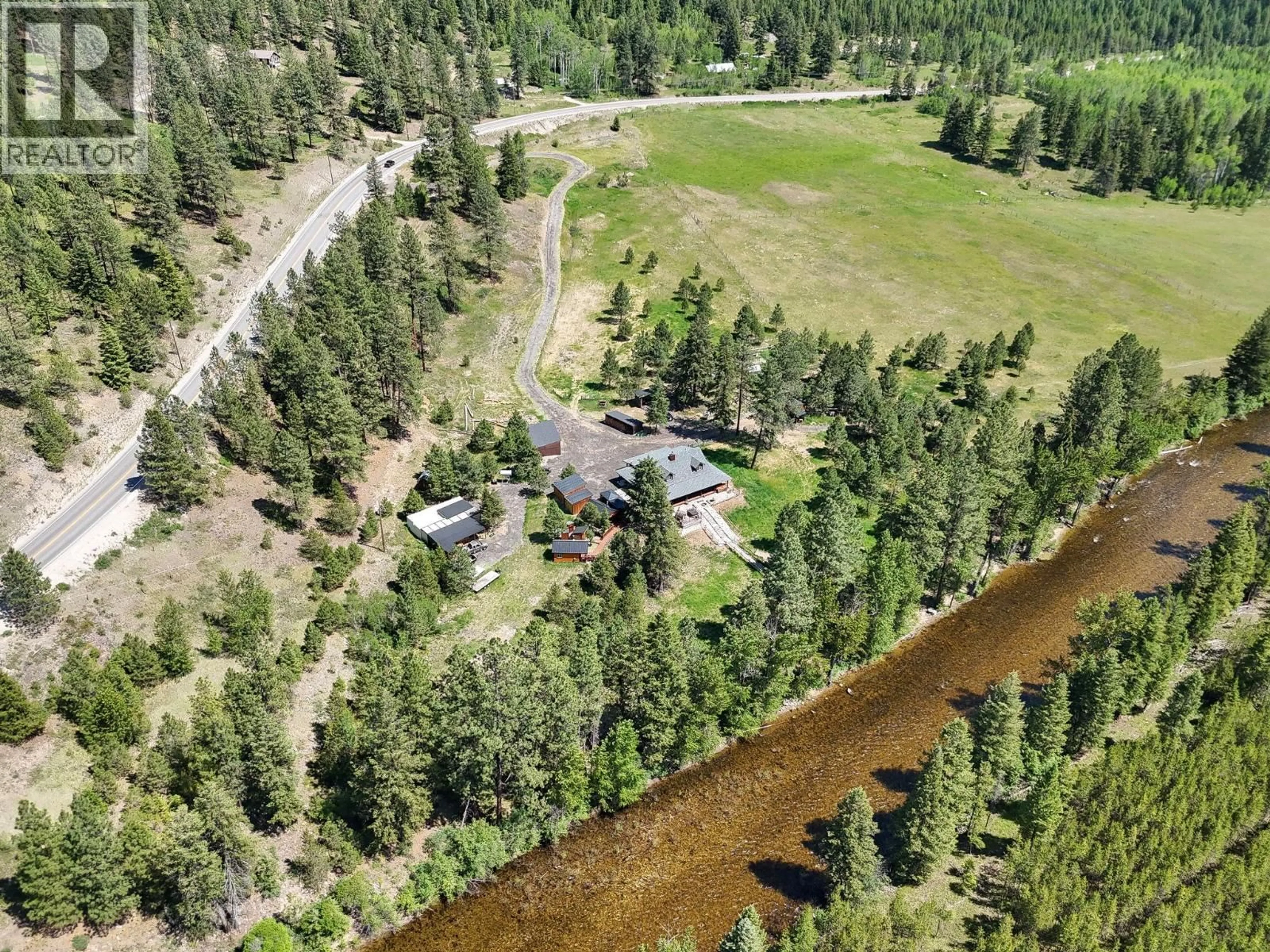 A pic from outside/outdoor area/front of a property/back of a property/a pic from drone, water/lake/river/ocean view for 6241 33 HIGHWAY, Carmi British Columbia V0H1A0