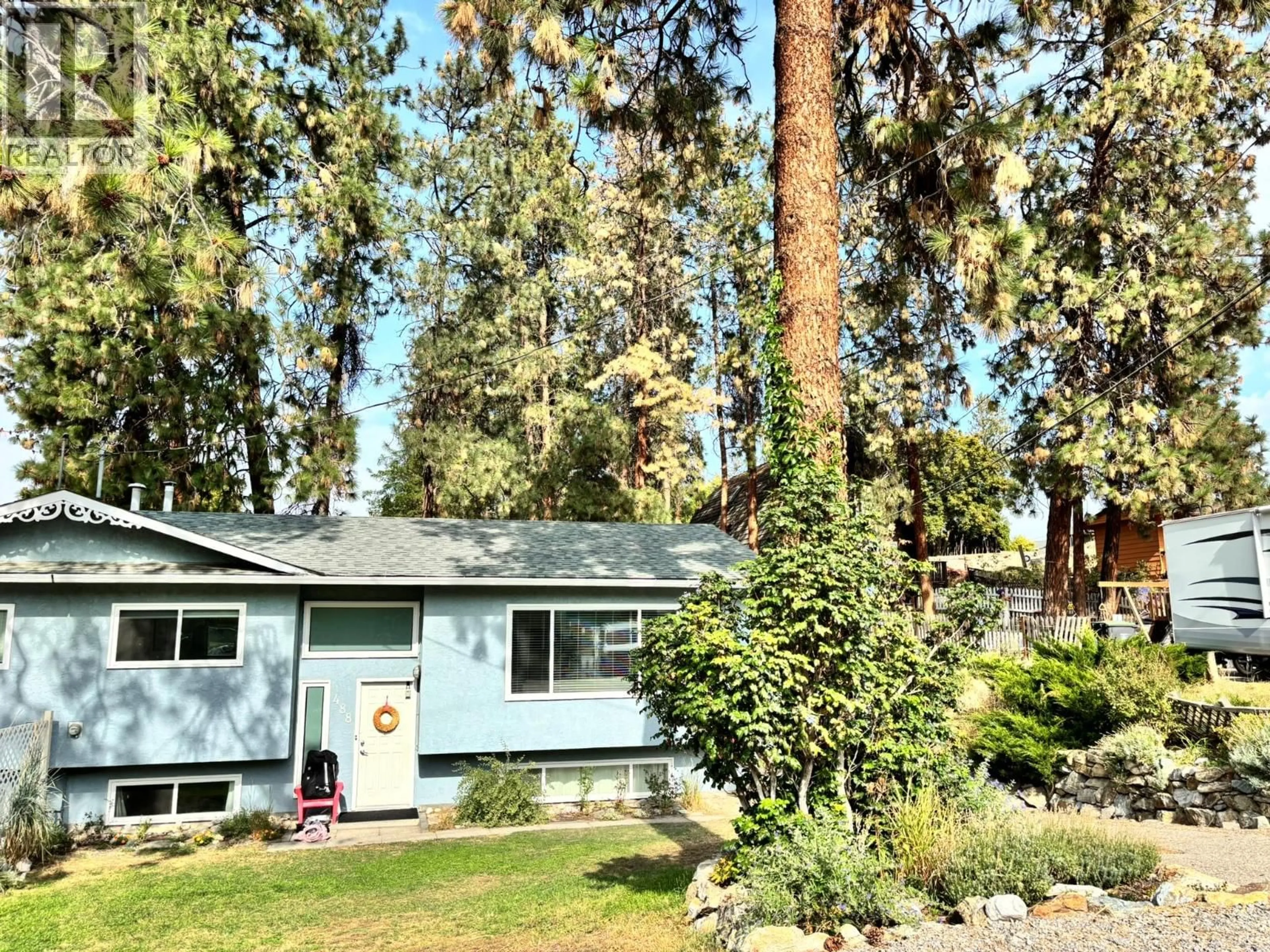 Home with vinyl exterior material, forest/trees view for 488 STANLEY CRESCENT, Kelowna British Columbia V1W4L7