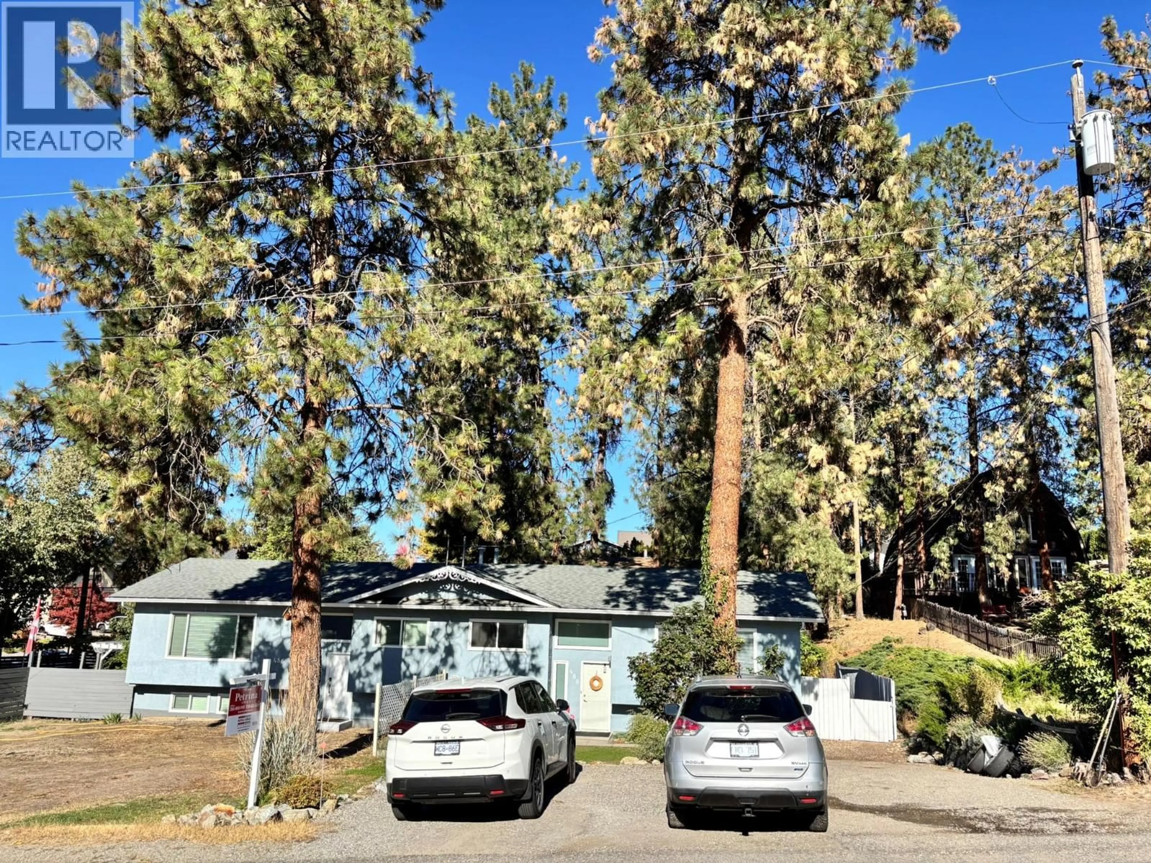 A pic from outside/outdoor area/front of a property/back of a property/a pic from drone, forest/trees view for 488 STANLEY CRESCENT, Kelowna British Columbia V1W4L7