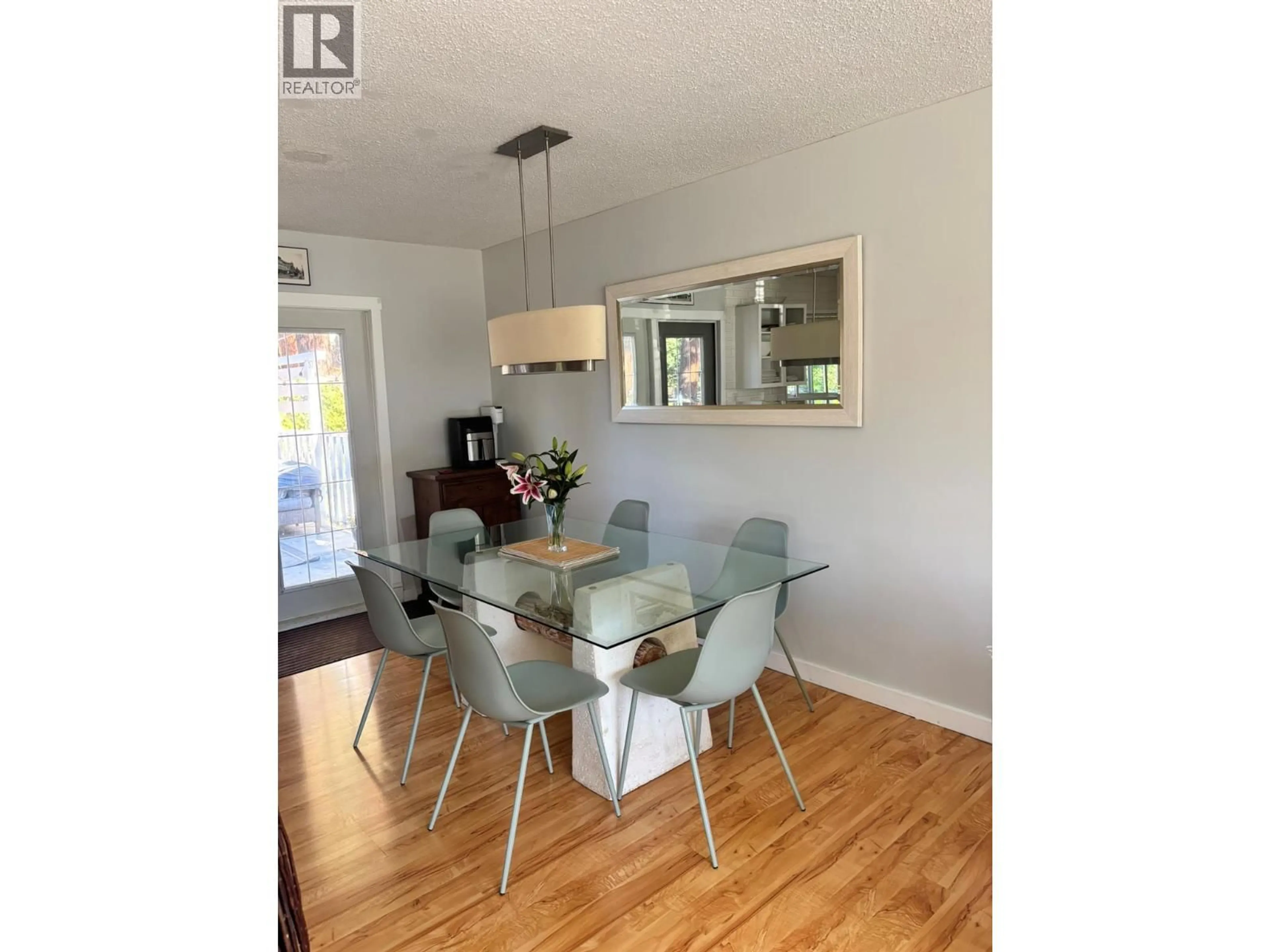 Dining room, wood/laminate floor for 488 STANLEY CRESCENT, Kelowna British Columbia V1W4L7